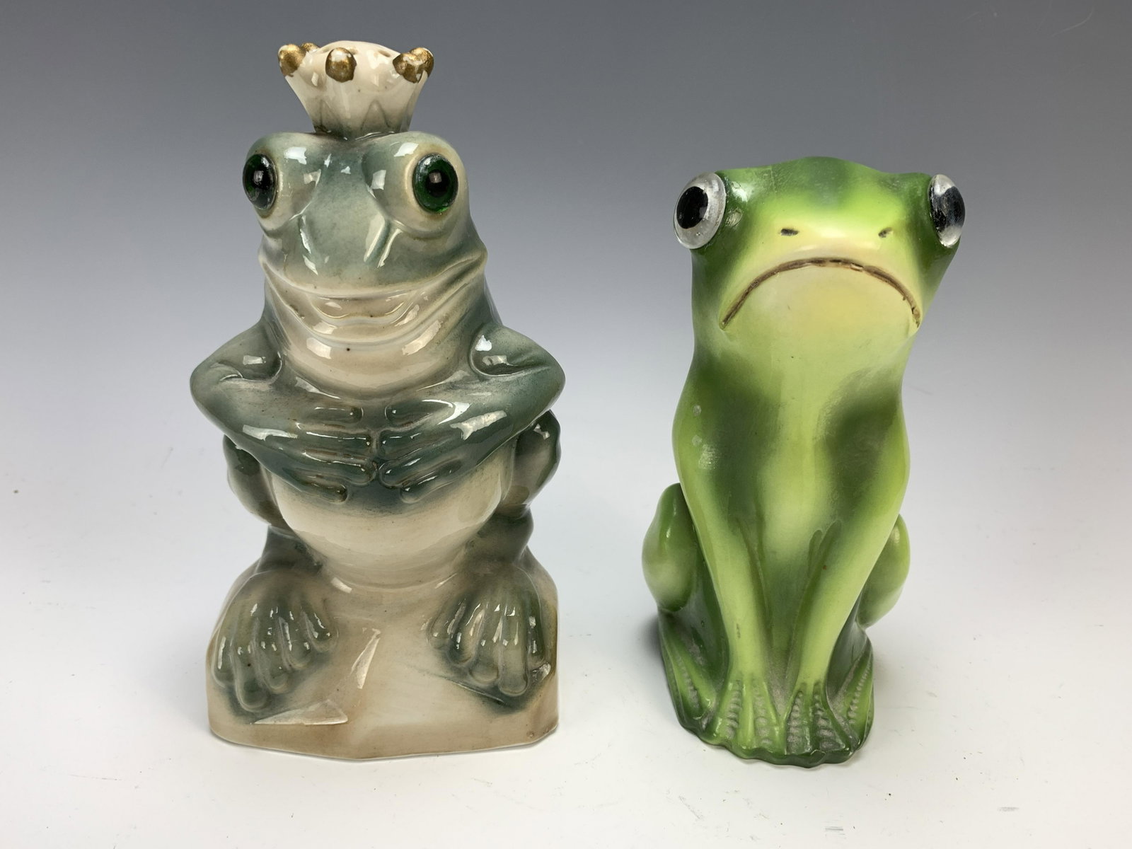 Pair Frog Vintage Porcelain Figural Nightlight: Circa 1930. Both with original sockets and glass eyes. Plugs removed. Tallest is 8". Condition: very good. Have a similar item to sell? Email us at info@treasureseekerauction.com