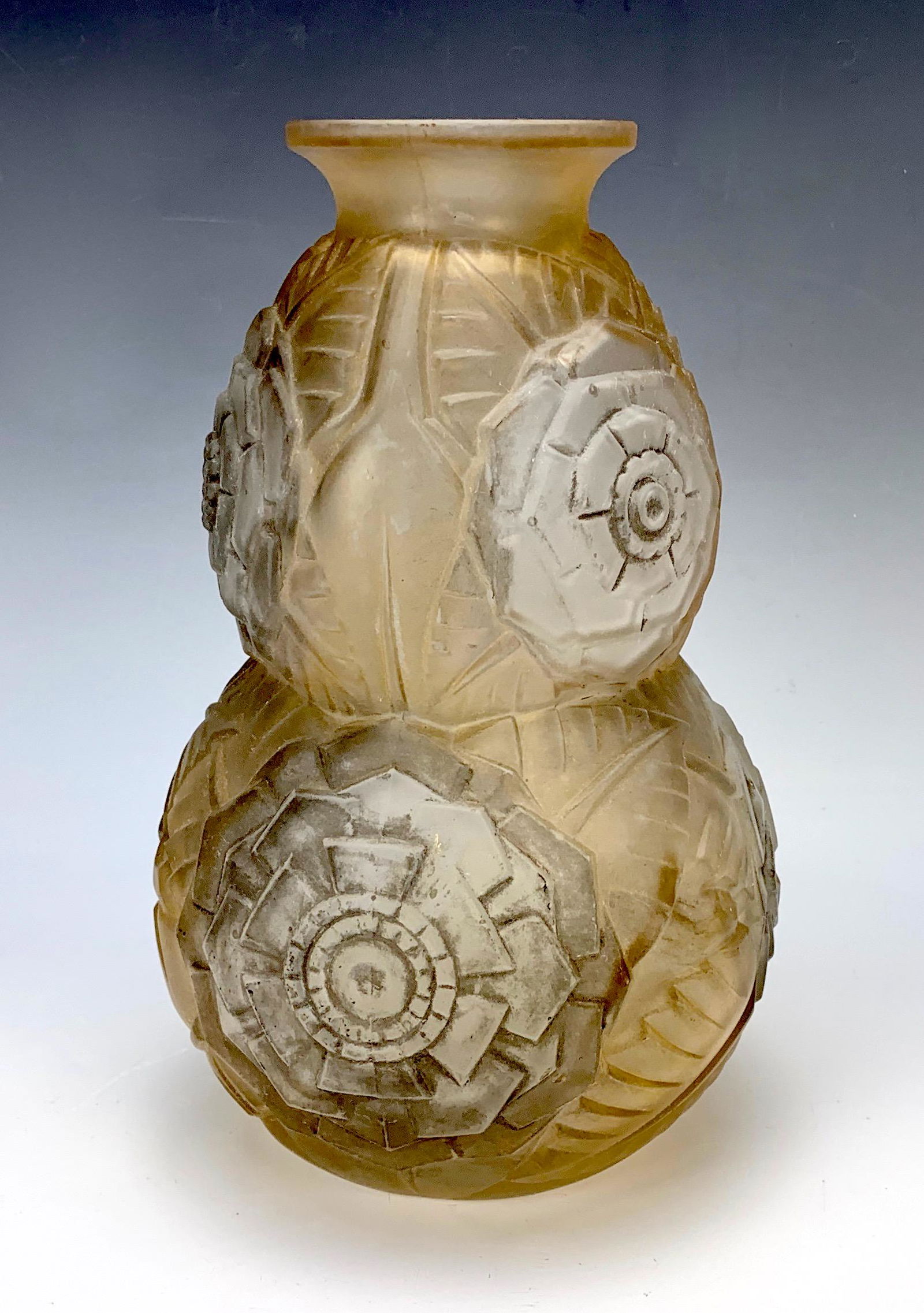 Signed Muller Freres Art Deco Vase C.1920.: Having a double gourd shape with geometric raised frosted glass body. Signed on bottom Muller Freres France. 2 color tint. 10" tall. Condition: Very Good.Have a similar item to sell? Email us at info@