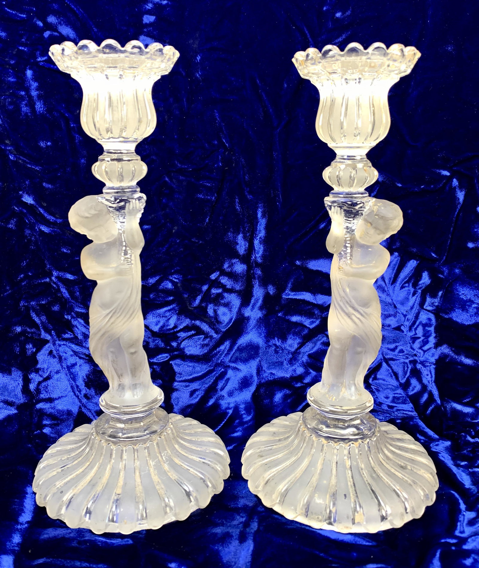 Pr Sgd Baccarat Putti Crystal Candlesticks: Circa 1900, pair of frosted and clear crystal Putti figural candlesticks, both signed "Baccarat" in raised lettering, 9.75" tall, very good condition. Have a similar item to sell? Email us at info@tre