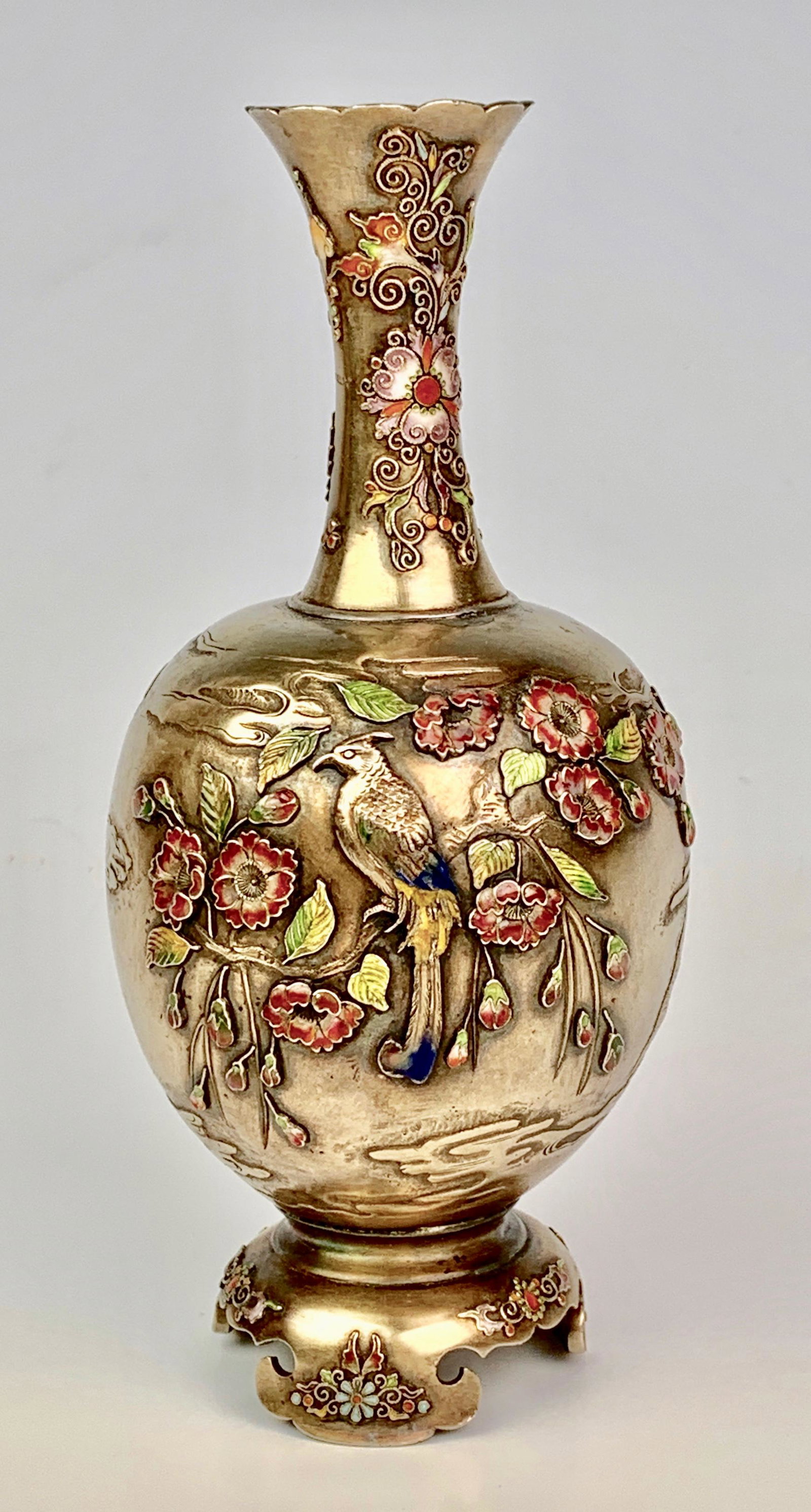 Japanese Silver & Enamel Vase, Meiji (1868-1912): Ovoid body decorated with a continuous scene of a bird with long tail feathers perched amongst blossoming branches of prunus, with details highlighted in pink, white and green, yellow and blue enamels