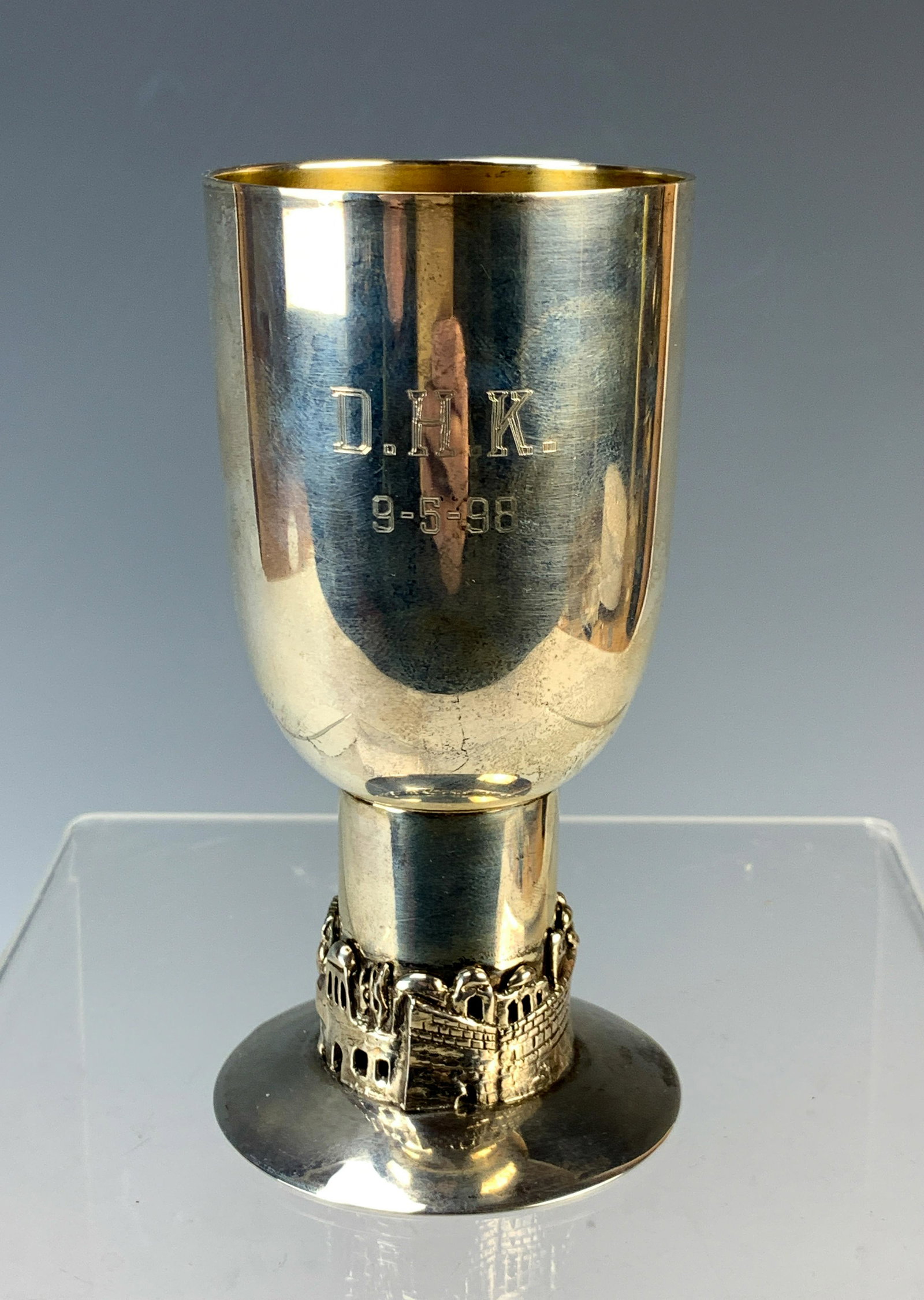 Bier Sterling Silver Kiddush Cup: Cup measures 5" high x 2 1/2" at the base and weighs a hefty 185 grams. It shows a Jerusalem panorama around the base and etched initials and date on the bowl. Signed on the bottom Bier sterling and t