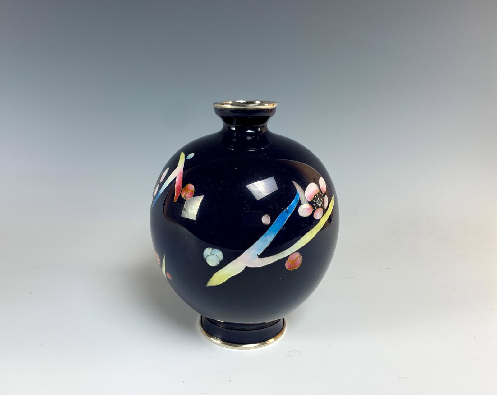 Japanese Ando Cloisonne Vase With Abstract Designs: This vase measures 6 1/8" high x approx 5" in diameter and weighs 406 grams. The colorful designs on a blue ground are delightful. Anything 50 years or older is considered 'vintage' and this was sold 
