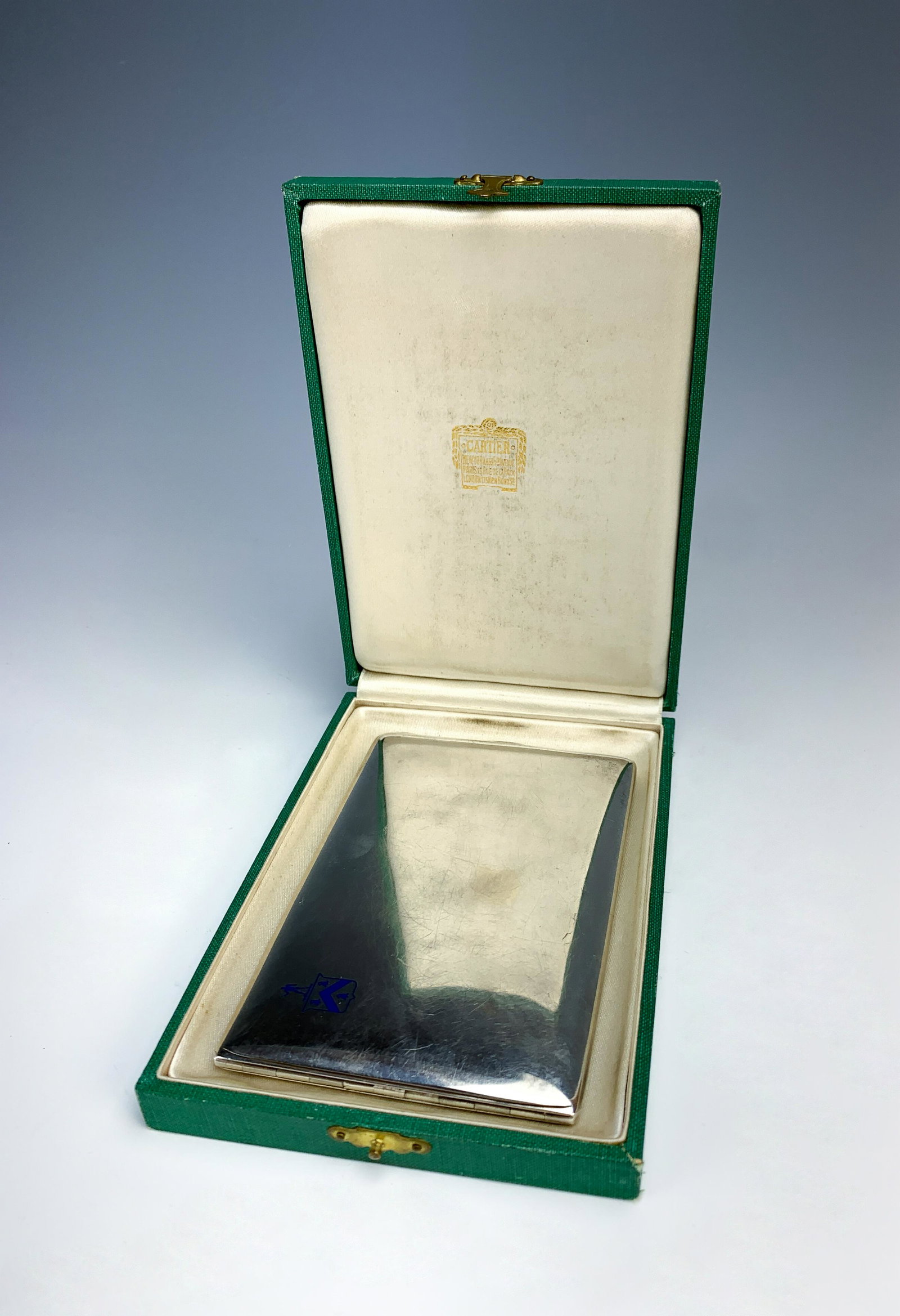 Cartier Sterling Silver And Enamel Cigarette Case: With its original display case marked cartier. Sterling # 21. Size: 4 5/8" x 3". Condition: Good!