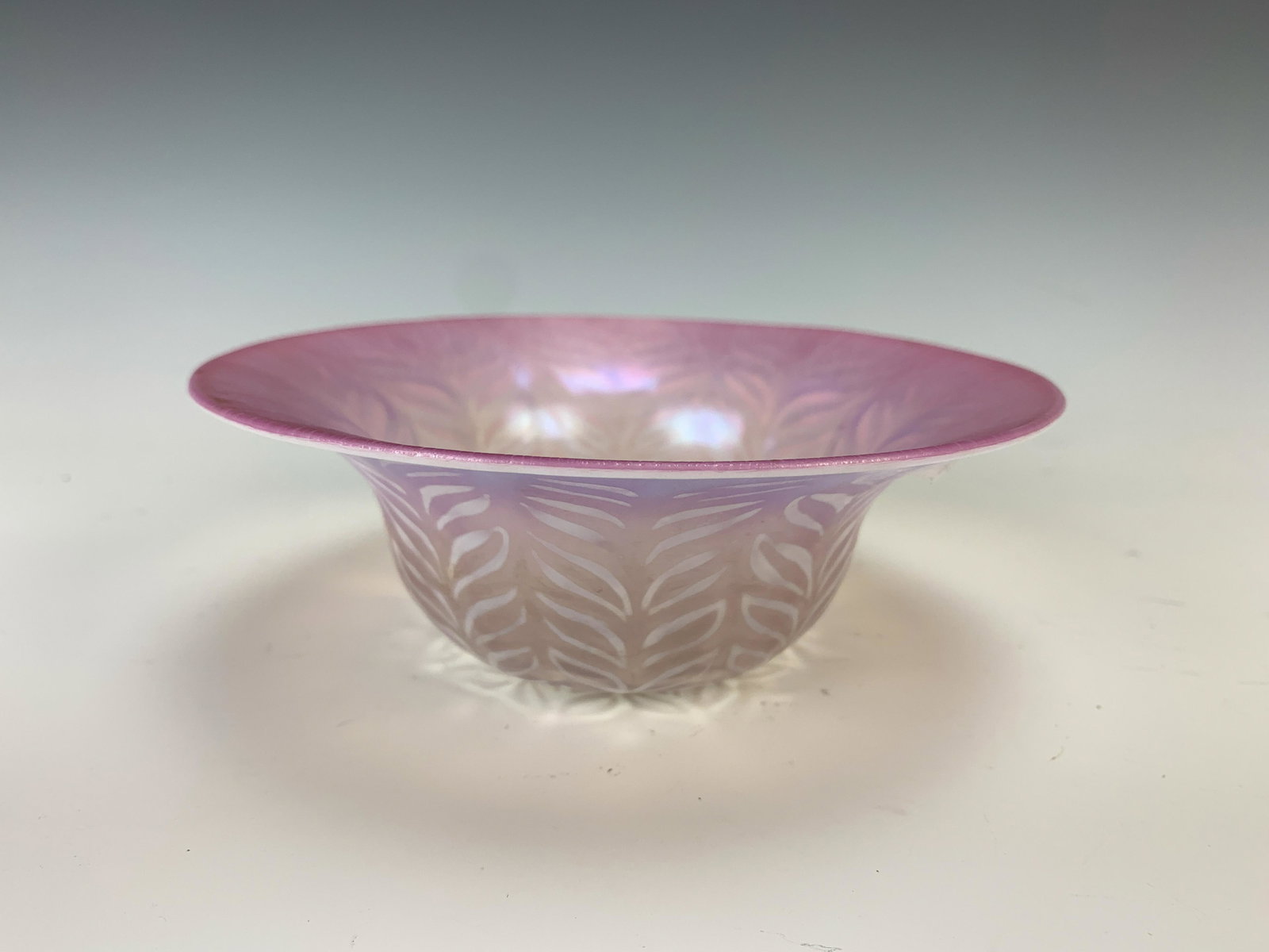 Tiffany Studios Pastel Optic Bowl: Tiffany Studios Pastel Optic Bowl. Fuchsia with opalescent features panels, signed "L.C.T. favrile 1926" around a polished pontil mark. Size: 2.25" tall x 6" diameter. Condition: Very good. Literature