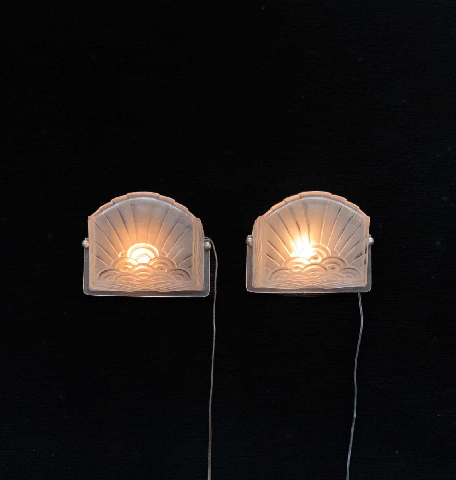 Signed Schneider Art Deco Wall Sconces: Made in France and signed Schneider, Paris. having a clear frosted Art deco design. Both are signed and are wired to work.C.1930's. Size: 7.5" w x 6" tall x 4" deep. Condition: Good.