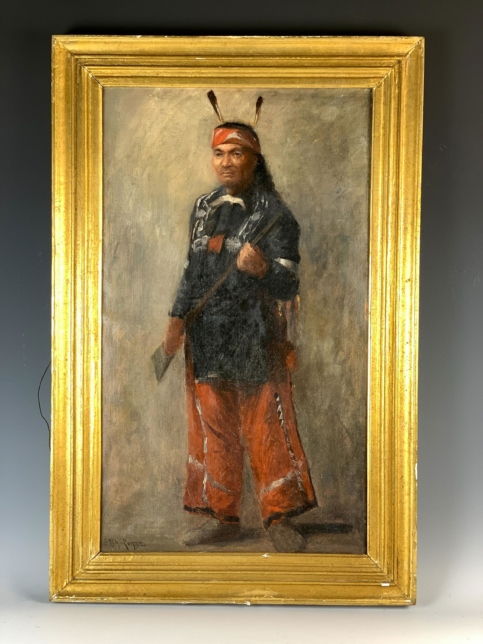 ADM Cooper Native American w/Rifle Painting: Oil on canvas. Depicting a native American standing with a rifle in his hands. Signed lower left A.D.M. Cooper. Size: 24" x 14" wide. With frame: 28" tall x 18" wide. Condition: relined, otherwise goo