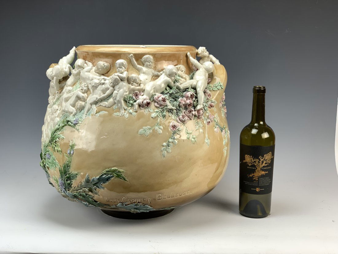 Louis R. Carrier-Belleuse (1848-1913) Large Vase: Circa 1895. Important large vase by and signed Louis Carrier-Belleuse. Its title given is "The Struggle For Life". Made of earthenware and decorated with cherubs in pate-sur-pate with a polychrome ena