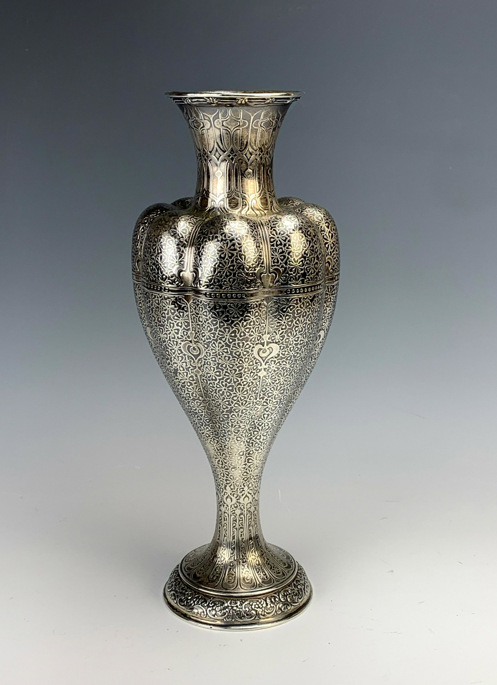 Tiffany & Co Sterling&Niello Islamic Style Vase: Late 19th Century. Moore's sketchbooks have a number of Islamic drawings, and this example is certainly one of them. Having a melon-shaped body with a narrowing flared-out neck, fine niello work throu