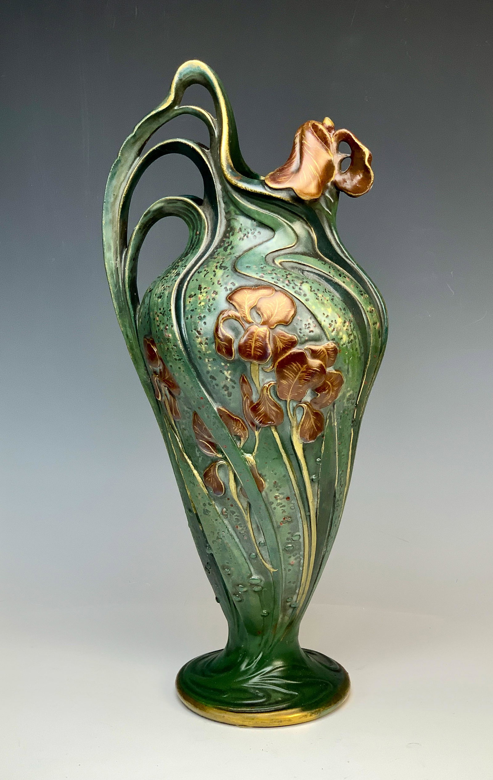 Rare Paul Dachsel Amphora IRIS Art Nouveau Vase: Highly sought after and rare Amphora "Iris" ewer by Paul Dachsel having a green body with handles modeled as art nouveau Whiplash vines, decorated with raised red irises overall including spout, light