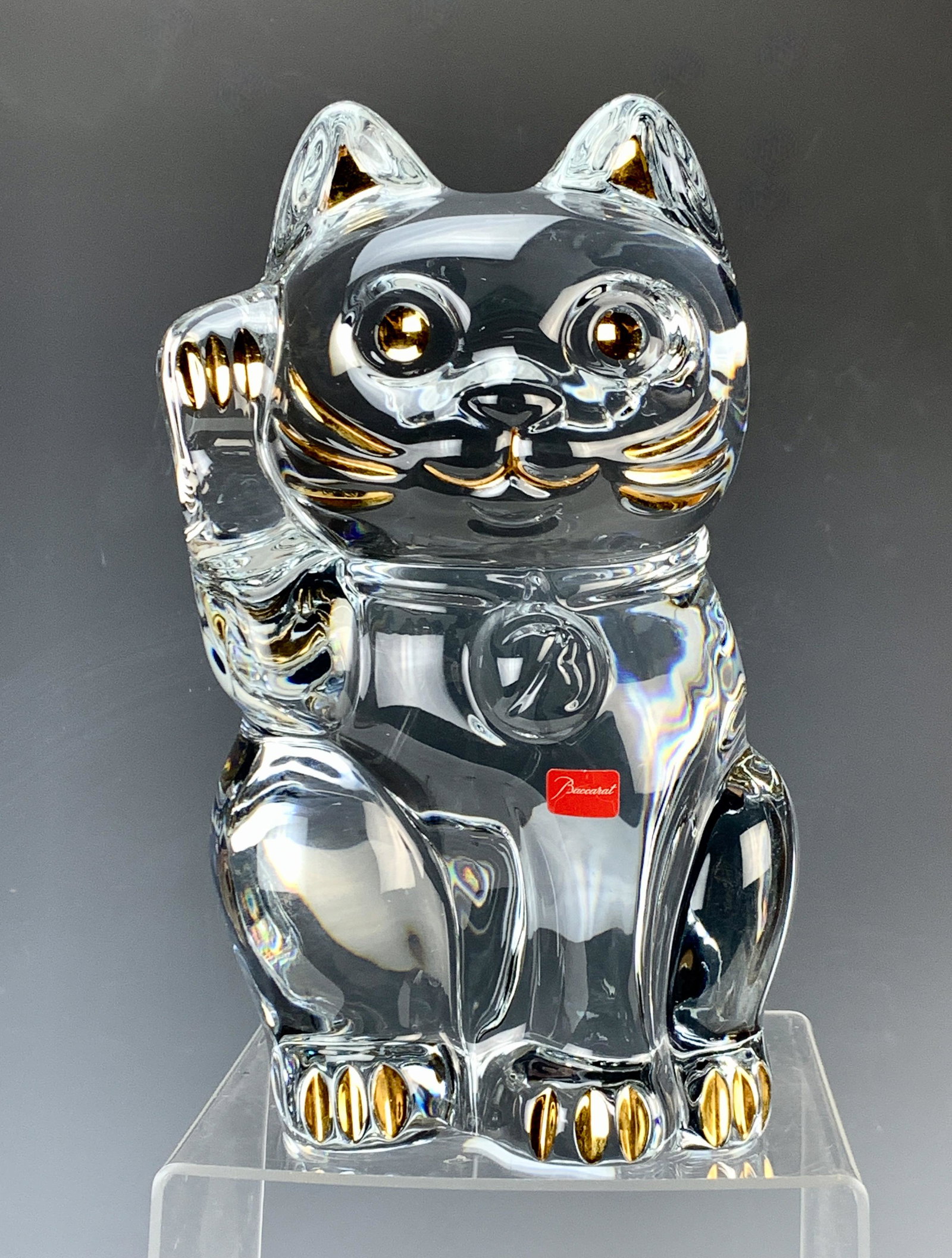 Baccarat "Lucky Cat" Figure: Baccarat called "Maneki-neko" in Japanese, lucky cat, good fortune. Measures 10" high x 5 1/2" wide by 5" deep and weighs a hefty 15lbs. Has 24kt applied flourishes to cat's ears, eyes, mouth, whisker