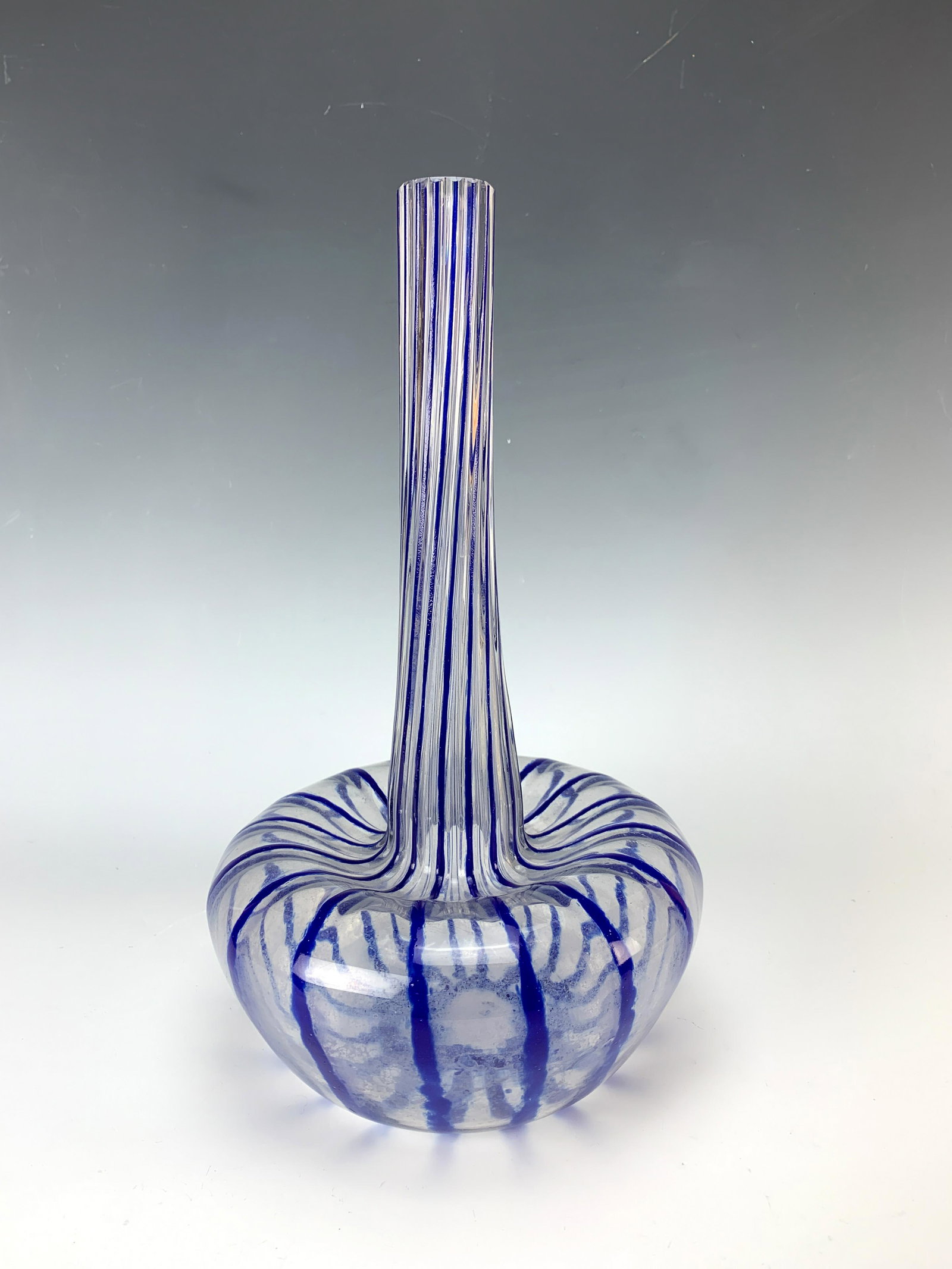 Schneider LeVerre Francais Blue Striped Vase Sgd: Rare vase made by Schneider-LeVerre Francais. Having a clear glass body with blue vertical stripes. Signed with the candy cane mark. Size: 12.75" tall. Very good condition.