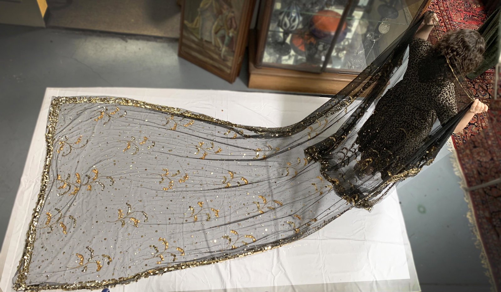 Long Sheer Black Cathedral Veil Cape: Long sheer cape with shimmering details on the edges, as well as gold bullion embroidery all over the fabric. Appears to be chiffon or tulle. Condition: some beads have fallen off, but overall really 