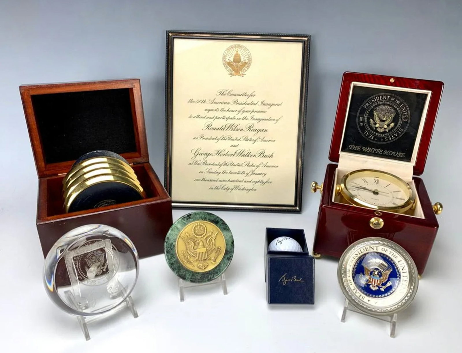 Collection of Presidential Memorabilia: Nice group of presidential memorabilia, included are inauguration invitation for Ronald Reagan framed, a signed golf ball in gift box for George Bush, a white house quartz movement clock in wooded cas