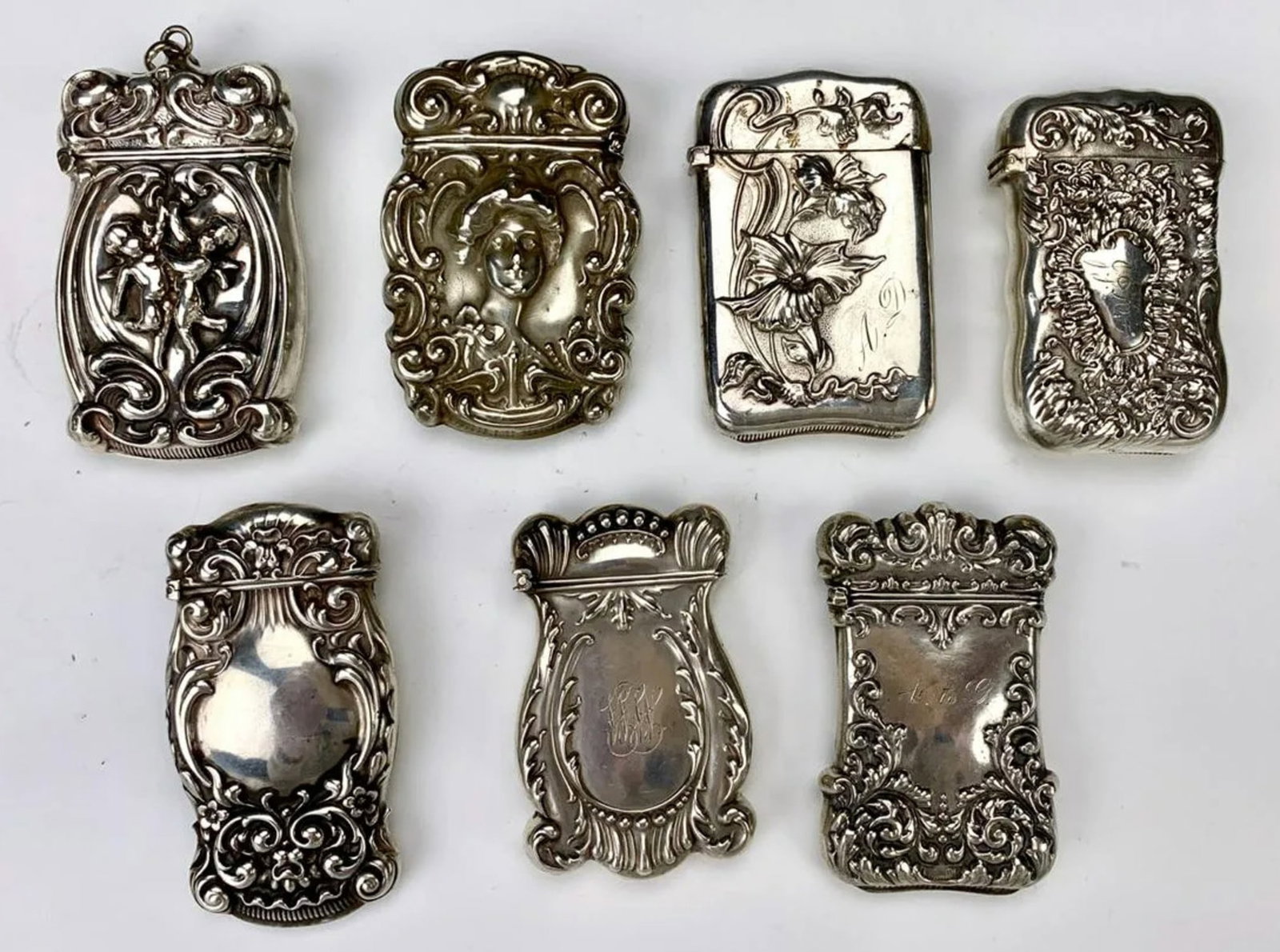 5 Sterling & 2 Silver Plate Victorian Match Safes: 1 marked "293 Whiting Sterling", 1 marked "Sterling Gilbert", 4 marked "Sterling", 1 marked "5916 Pairpoint MFG. Co."