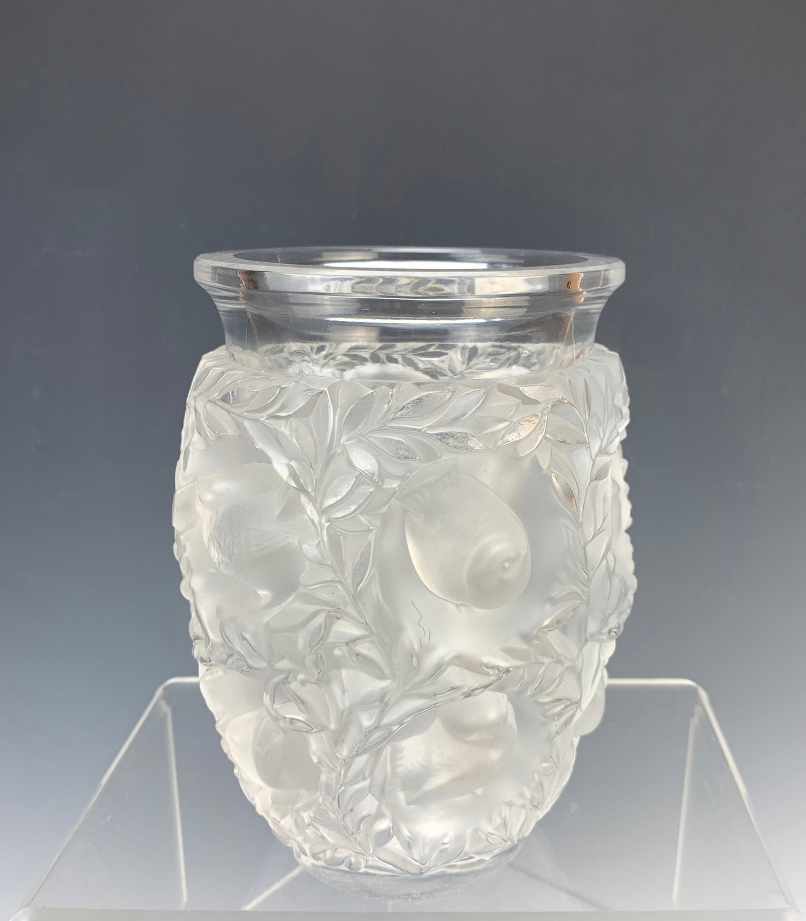 Lalique Bagatelle Vase: It measures 6 1/2" high by 4 3/4" wide and weighs 5 1/2 lbs. It is designed with little finches all around. Signed on the bottom and shows wear there. Overall condition is quite good though.