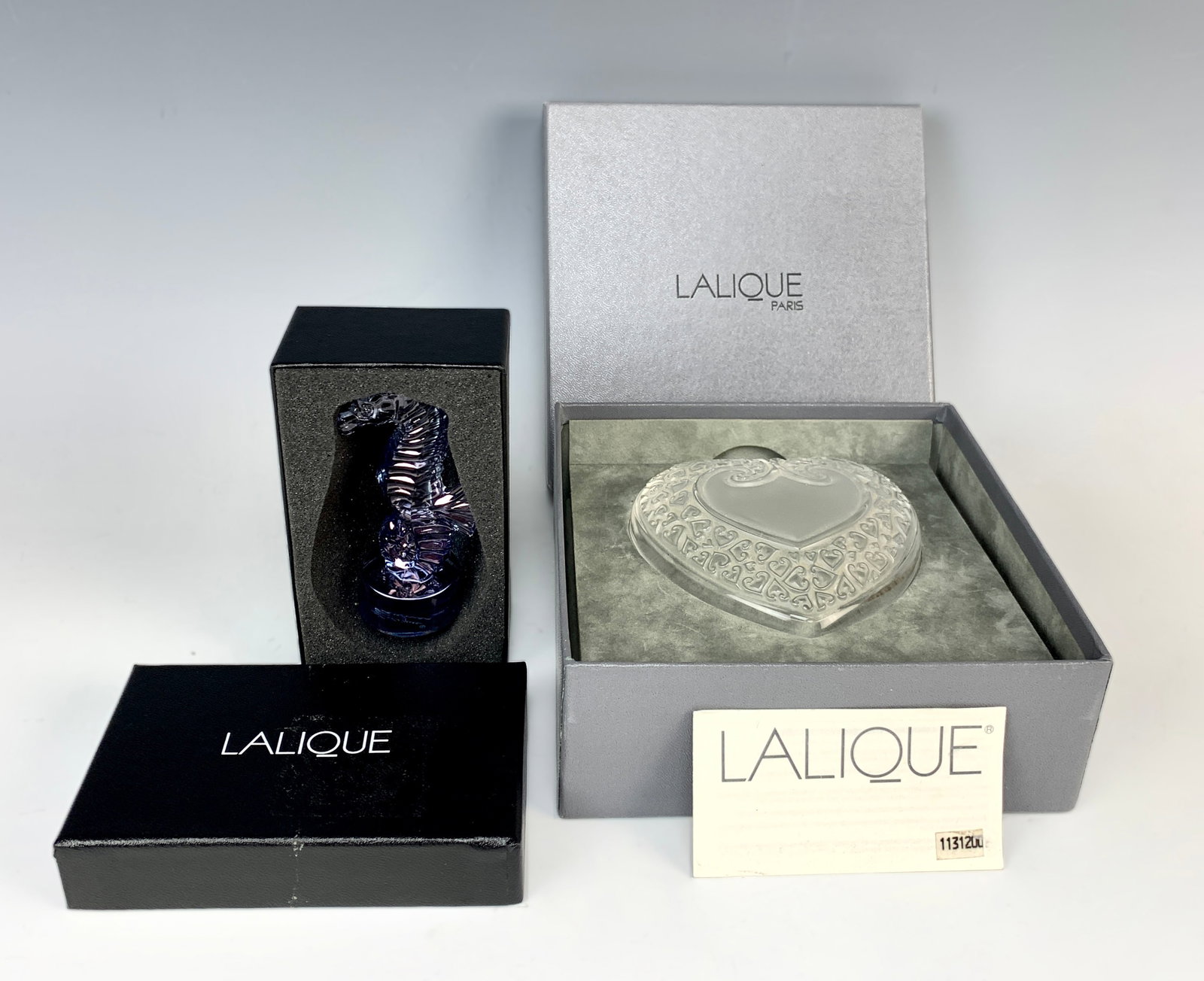 Lalique Seahorse Sculpture&Coupelle Box wHeart Lid: This lot comes with two lalique items, first is a Lalique Blue Luster Seahorse Sculpture which measures 3 1/2" high and is new in a fitted box. In 2015 retailed for $395. Signed and in excellent condi