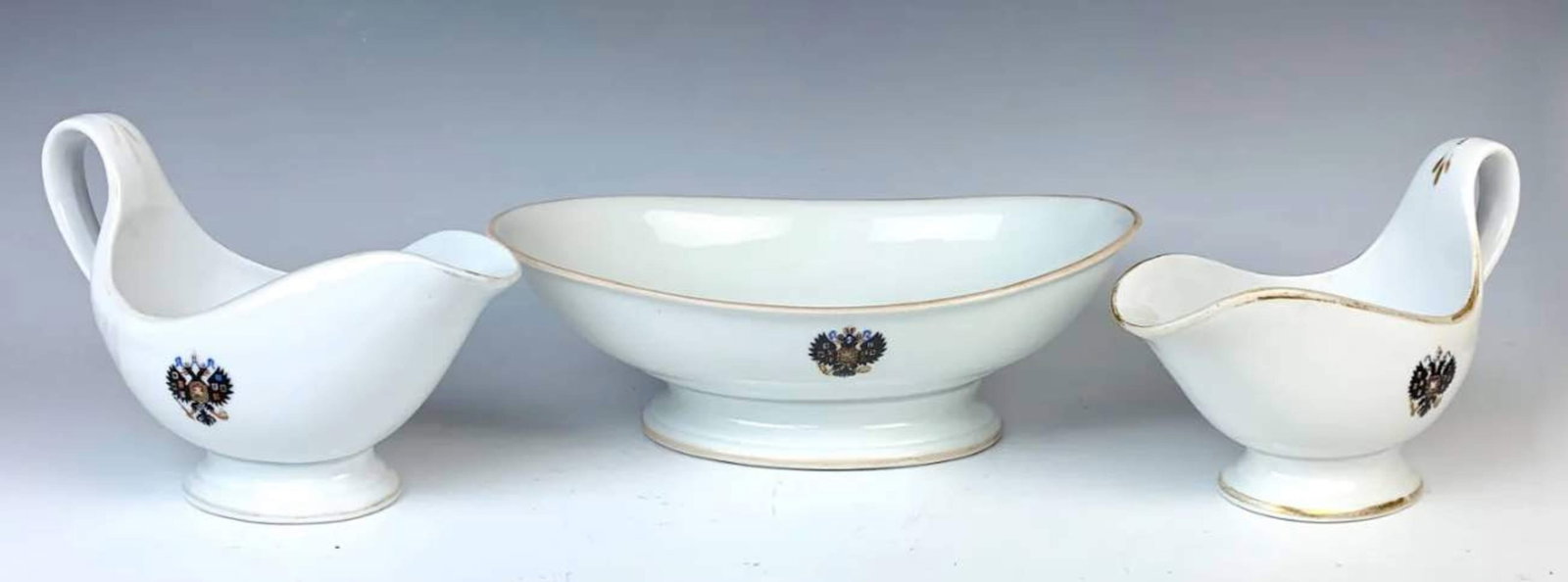 3 Pcs. Kuznetsov Russian Porcelain Set: Included are 2 gravy boats and an oblong bowl, each having blue crests for Nicholas II. All signed. Size: 12" widest. Condition: Good!