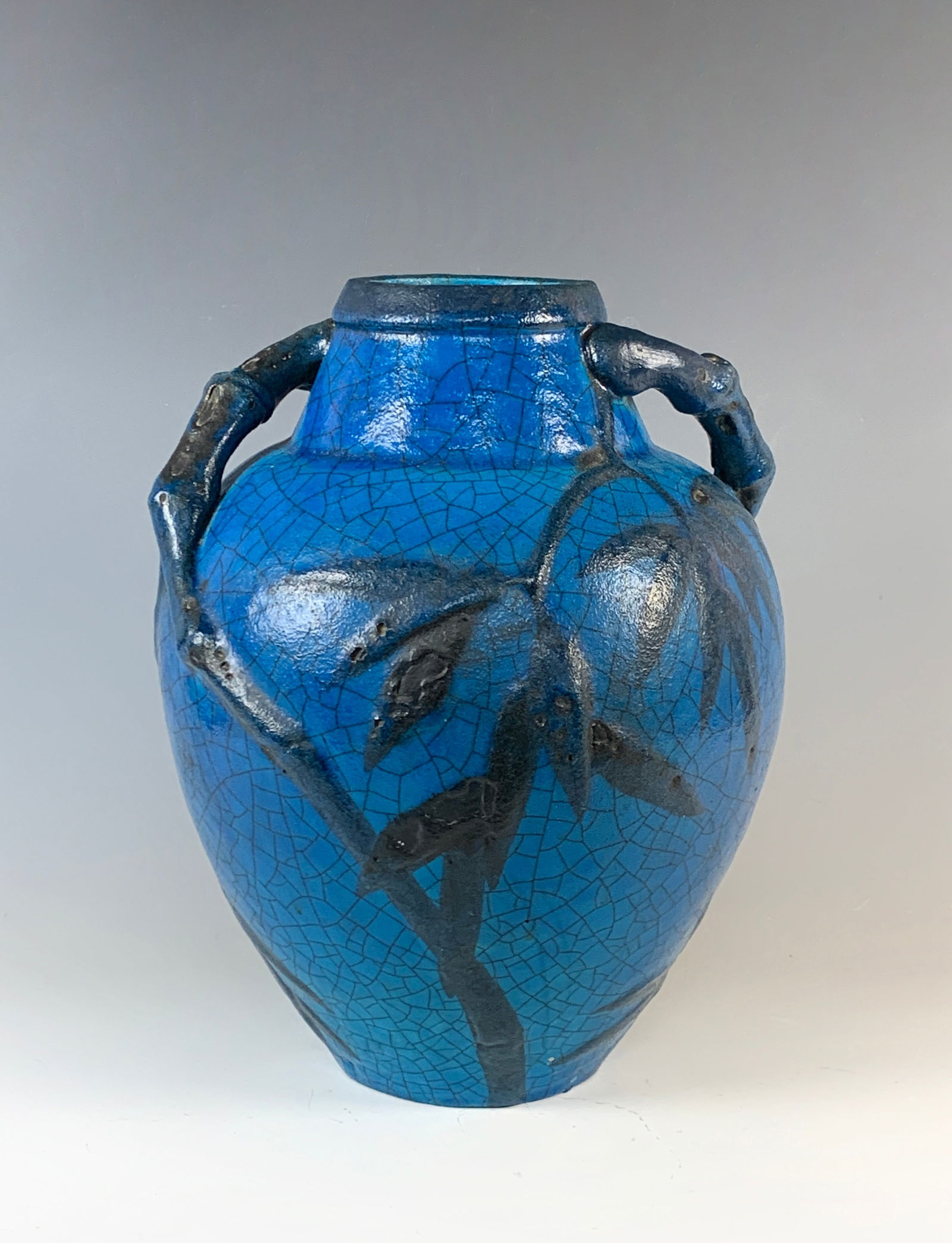 Edmond Lachenal (1855-1948) Art Pottery Vase: Early 20th century. French art pottery "Japanesque" vase by Edmond Lachenal, decorated with raised bamboo leaves and stems on a turquoise blue craquelure glazed ground. The vase features bamboo branch