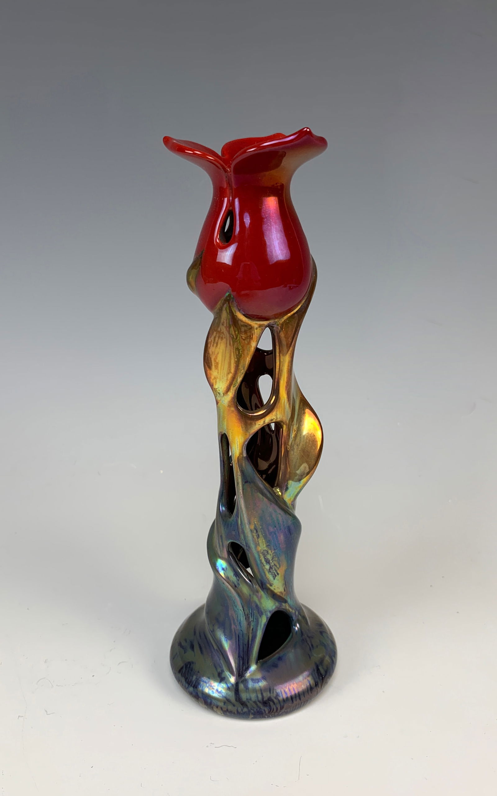 Sgd Zsolnay Eosin Tulip Art Nouveau Candlestick: Rare Zsolnay tulip eosin Art Nouveau/Jugendstil style candlestick. Signed Zsolnay and numbered 10202. Size: 7.75" tall. Condition: very good.