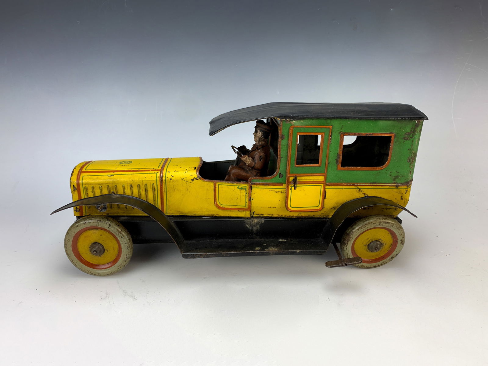 Gunthermann Nifty Tin Windup Limousine Toy Car: Very unusual tin windup limousine toy marked "s6" on the hood, "Nifty Reg U.S. Pat Off" on the grill and "Made in the USA" on the back of the automobile, car looks like a deluxe Gunthermann limousine