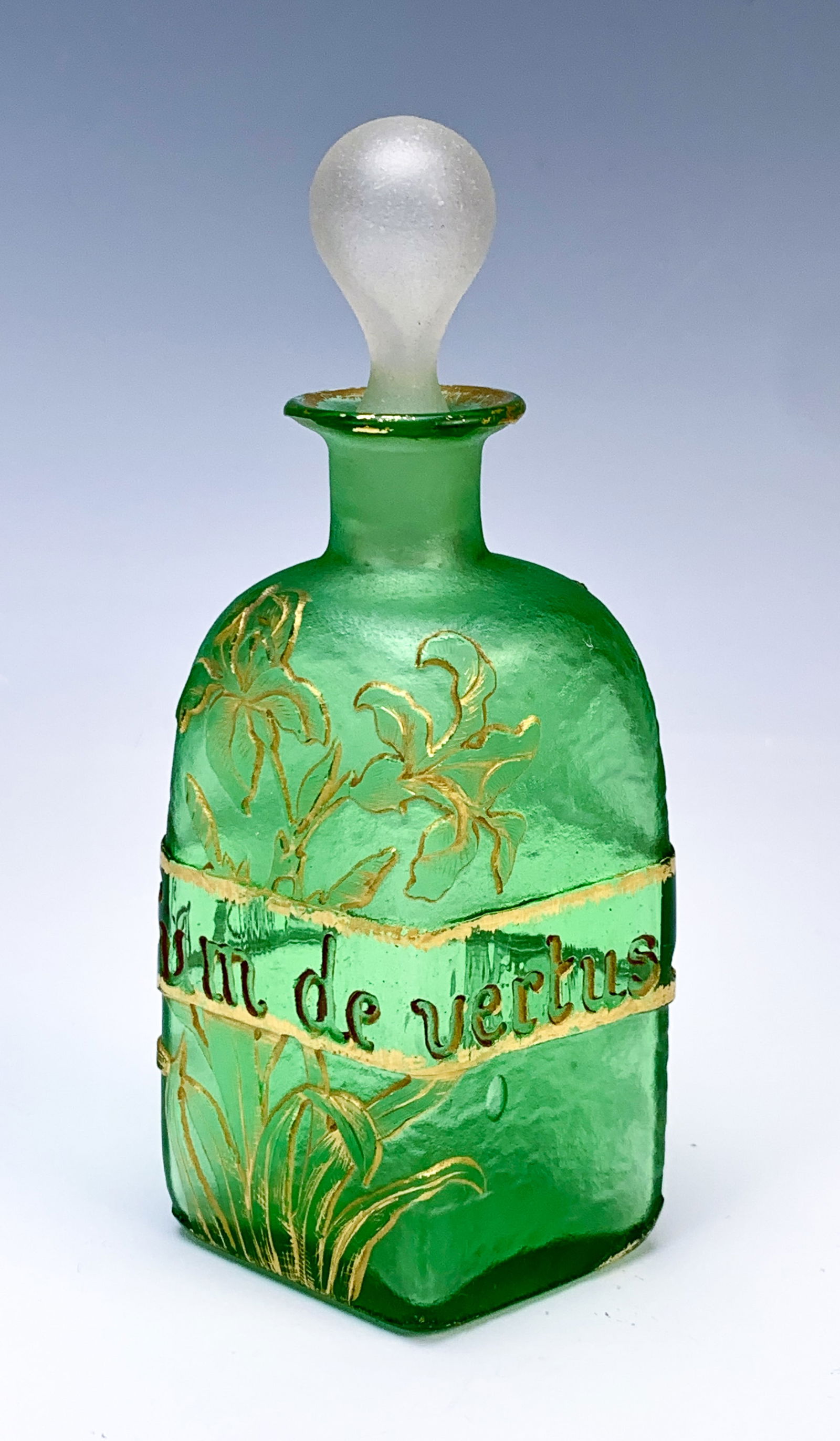 Daum Nancy Cameo Glass Perfume Bottle: Daum Nancy "Perfume of Virtues" French art glass perfume bottle having a green glass body with cameo irises and foliage, with carved phrase "Parfum De Vertus" in French with means Perfume of Virtues,