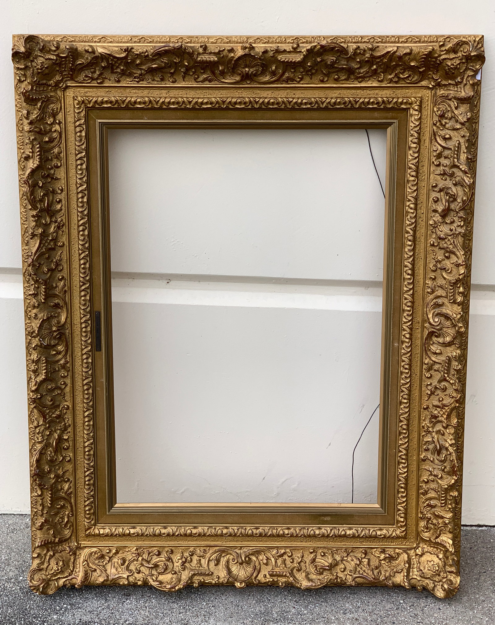 Large Ornate Antique Frame: This is a quality antique frame measuring 27.5" x 22" inside and 38.5" x 30.55" outside. Frames like this, new, are very rare and expensive. Sold to the highest bidder. Condition: Very good.