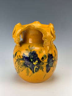 Clement Massier (1844-1917) Four Handle Vase: C.1900. Orange Pottery Vase decorated with hand-painted flowers. The top forms four fold back handles. Size: 7.5" tall x 6" wide. Condition: Very good.