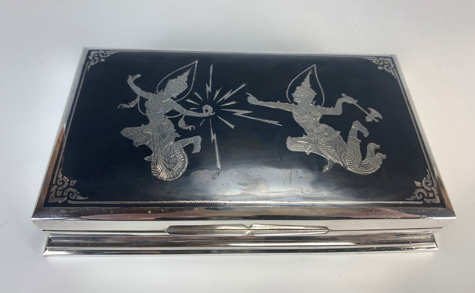 Siam Sterling Silver Box with Wood Inlay: Has a plaque inside for the Thai Minister of Industry. Signed box, made in Siam between 1946-1948. Solid closure and condition is excellent. Size: 7 3/8" long x 4 1/2" x 1 1/4" high and weighs 421 gra
