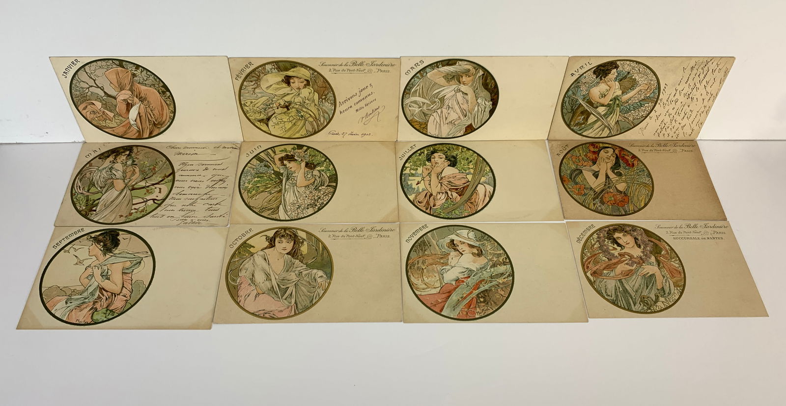 Alphonse Mucha (1860-1939) "Les Mois" Set 12: Having the rare complete set of 12 original Mucha "Les Mois" (Months) postcards, catalog #461-472. All signed Mucha and come with protective sleeve. Size: 5.5" x 3.5". Condition: Good.