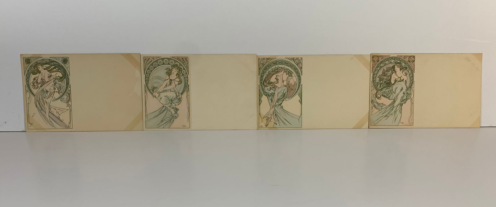 Alphonse Mucha (1860-1939) "Les Quatre Arts" Set: Offering the complete set of 4 "Les Quatre Arts" lithographic postcards. All signed Mucha. All come with protective sleeve. All originals and signed. Size: 5.5" x 3.5". Condition: Good.