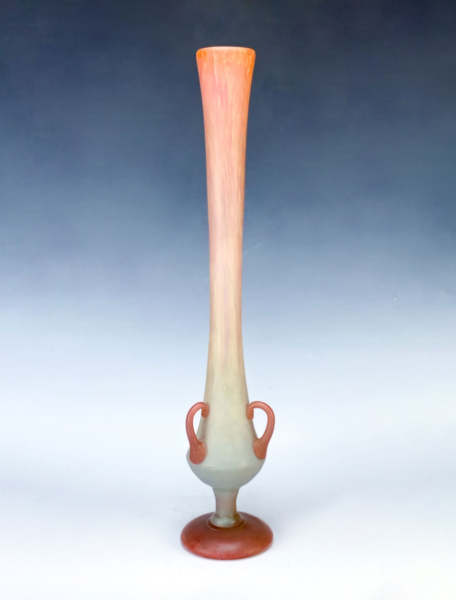 Daum Nancy 3 Handled Deco Vase: Has a squat bulbous body with tall slender neck. Flared top rim. Three applied orange handles, glass is orange mottled gradually turning to yellow. Signed on the side with carved "Daum Nancy" and cros