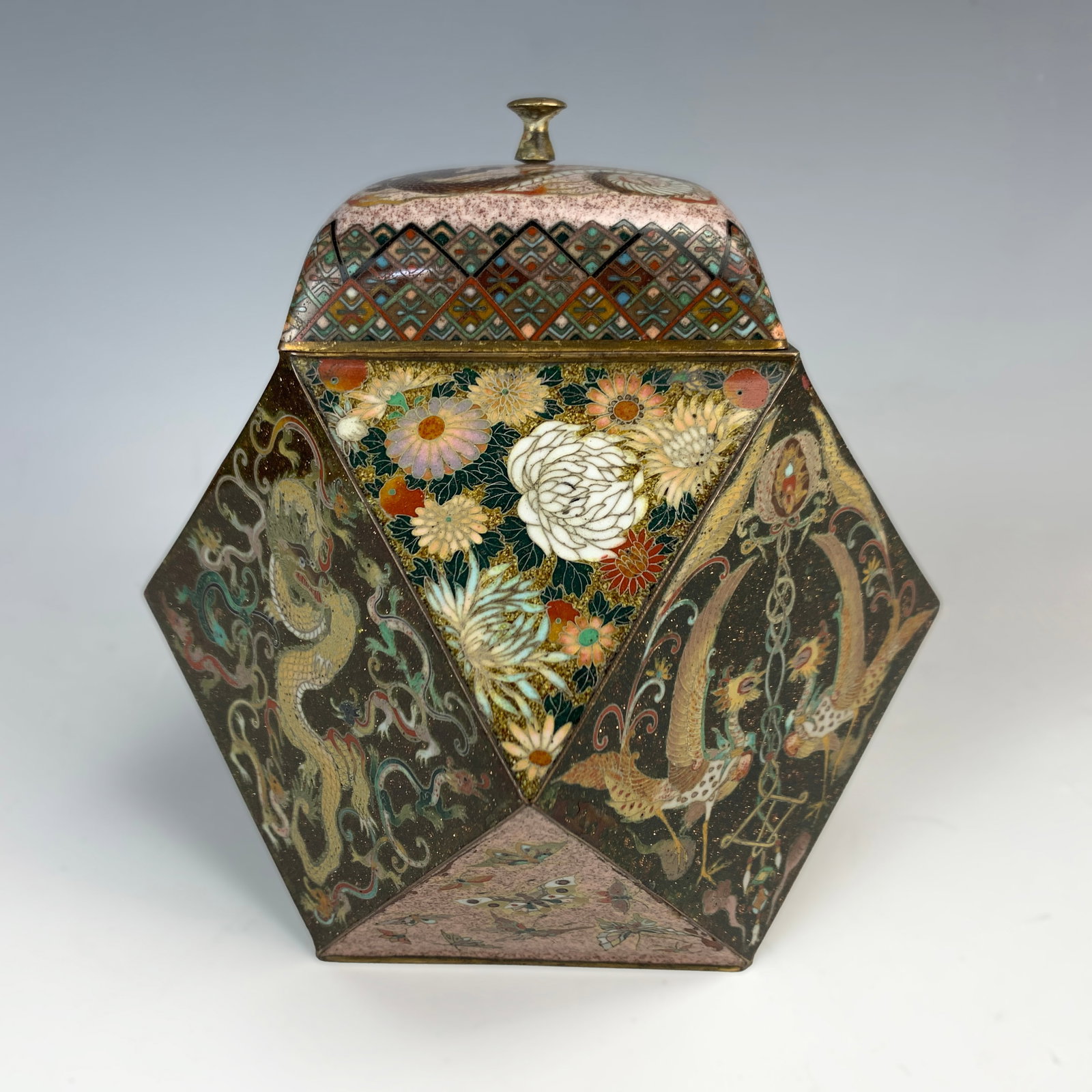 Rare 12 Sided Cloisonne Covered Box: Most unusual Japanese Meiji period cloisonne covered box in a 12-side shape. Center sides decorated with pairs of phoenix birds against a black ground with dragons. Top 4 sides decorated with butterfl