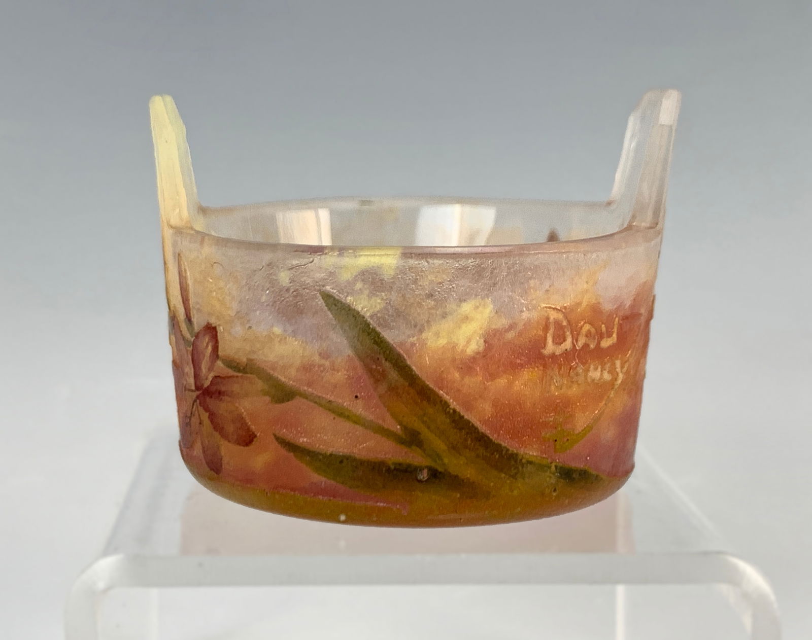 Daum Nancy Signed Floral Cameo Glass Salt: Round tub-shaped salt dish in red and clear glass, decorated with flowers and leaves in cameo glass. Signed in cameo "Daum Nancy" with the cross of Lorraine. Size: 1.25" tall x 1 5/8" wide. Condition: