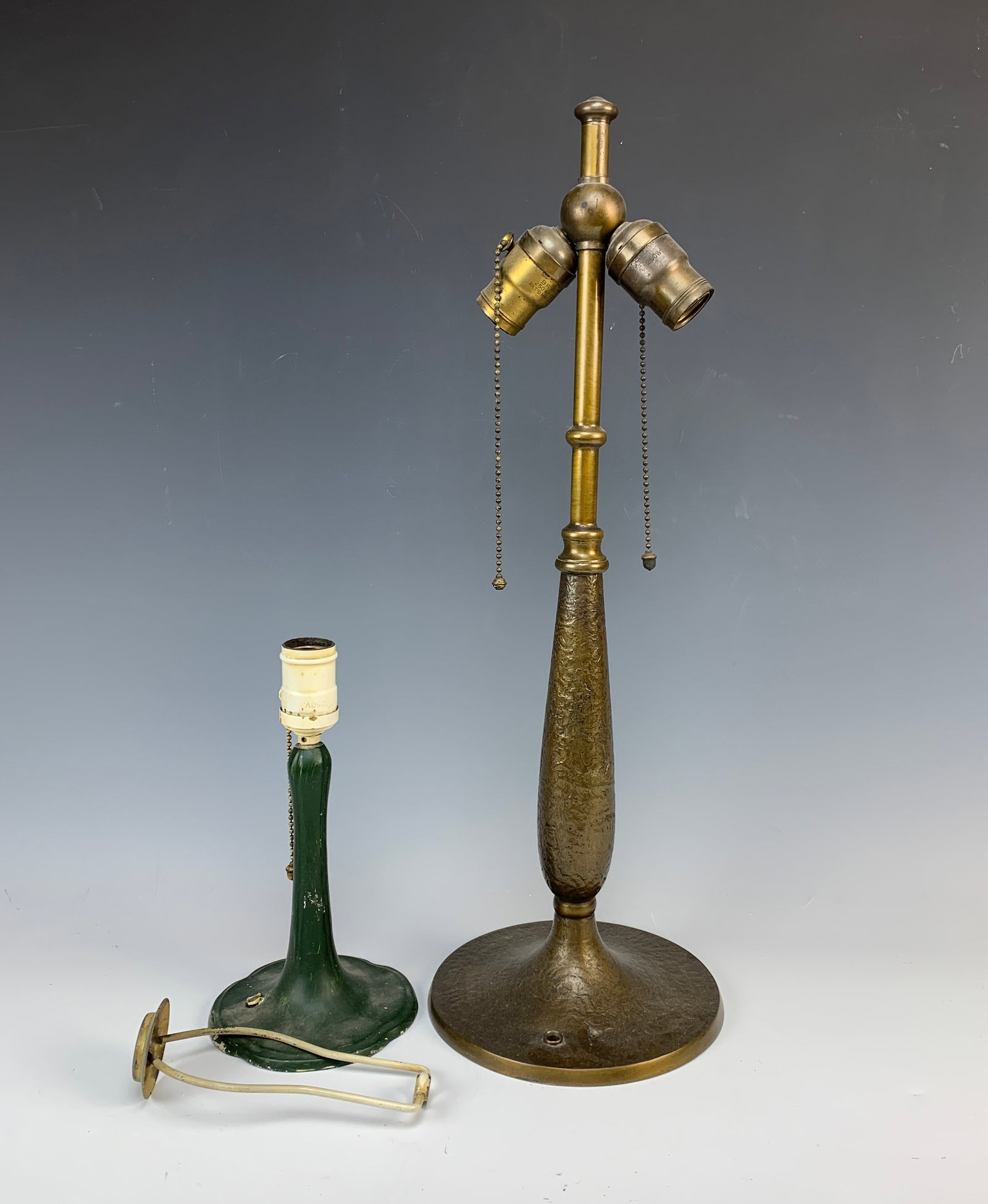 Pair Signed Handel Lamp Bases: Included in this lot are: 1 signed Handel table lamp base, 1 boudoir base signed on felt with Handel tag. Condition: table lamp bae is good. Boudoir lamp base is signed with felt tag which needs to be
