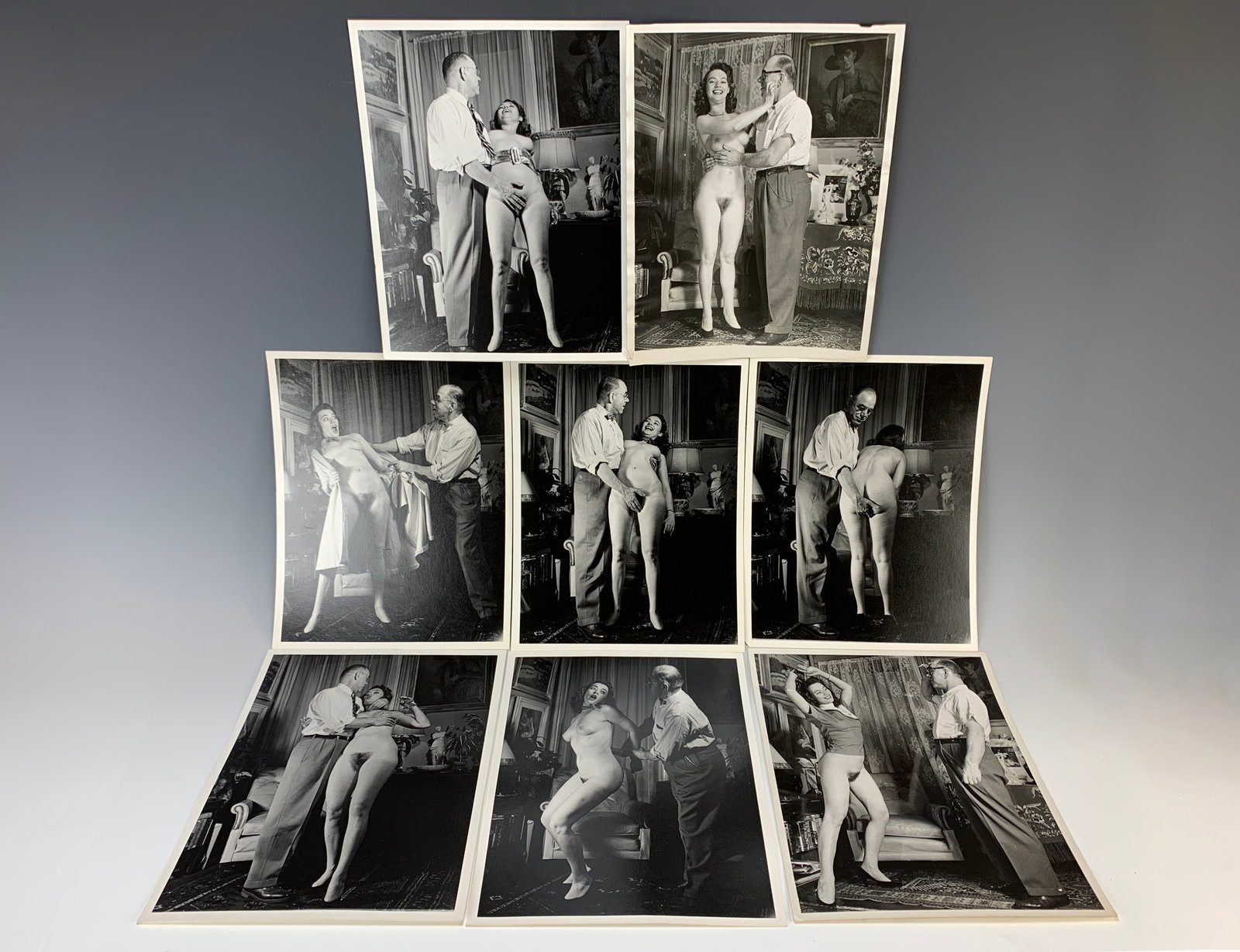Collection of 8 Vintage Erotic Nude Photos: Circa 1950, 8 vintage albumen silver prints of female nudes and their photographer in humorous poses, size: 10" x 8", a couple of them with minor wrinkle, otherwise in good condition
