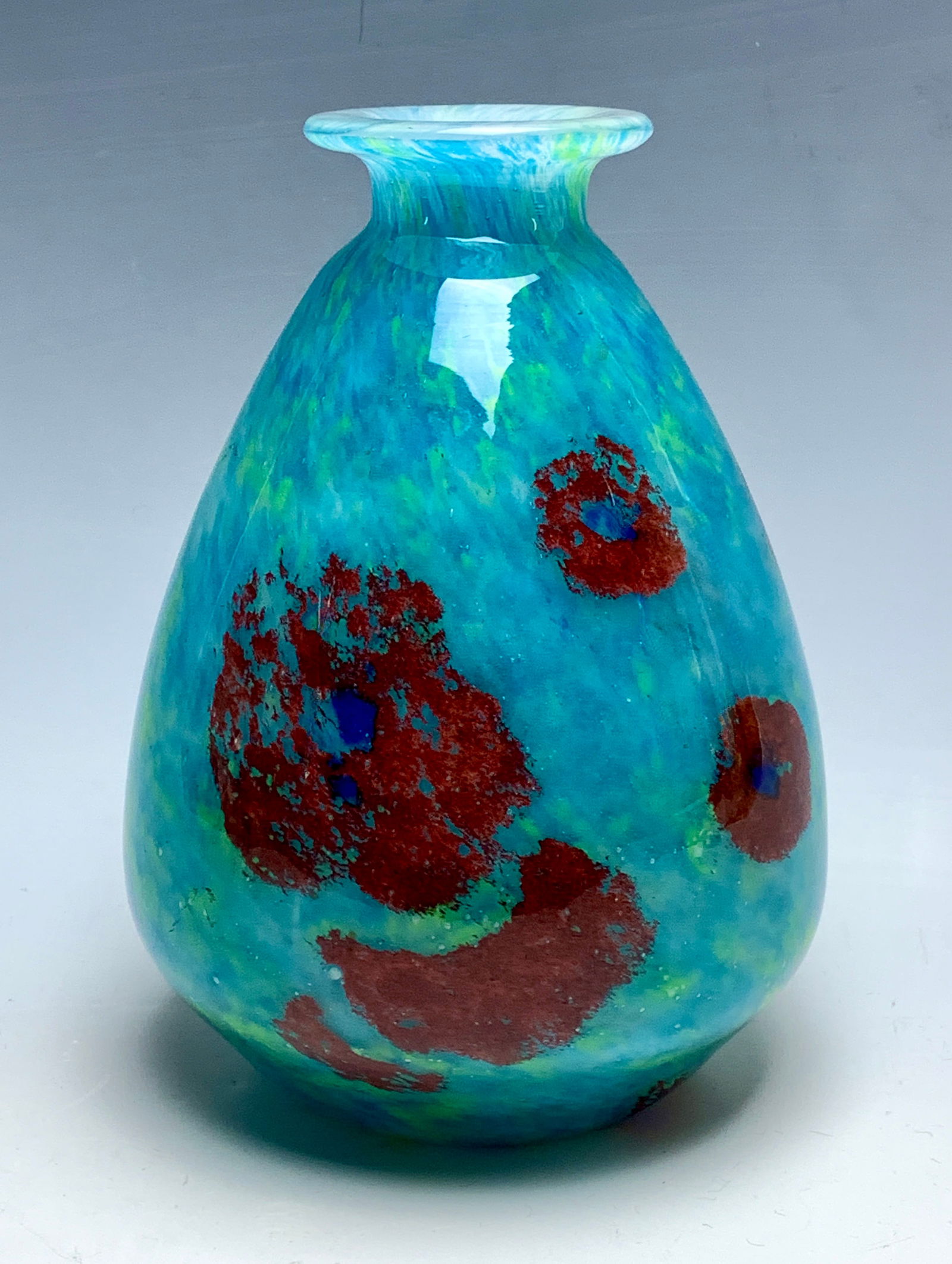 Charles Schneider Art Deco Teardrop Art Glass Vase: Circa 1920's. Charles Schneider (1881-1953) Overall decorated in mottled blues and greens with deep red blotches surrounding the sides signed with acid mark Schneider. Size: 9" tall. Condition: very g