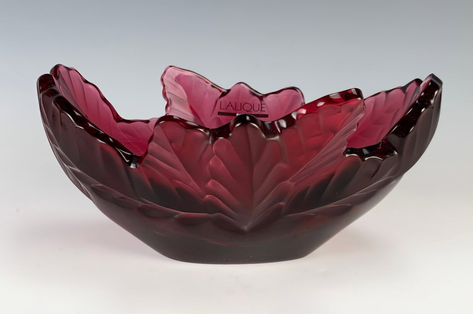 Lalique "Red" Compiegne Bowl: Signed on the bottom edge and numbered 202 on the bottom. Retired in 2016. Size: 7 3/4" long x 6 5/8" wide x 4 1/4" deep. Comes with original Lalique display box. Weight: 3 1/2 lbs. Condition: Brand n