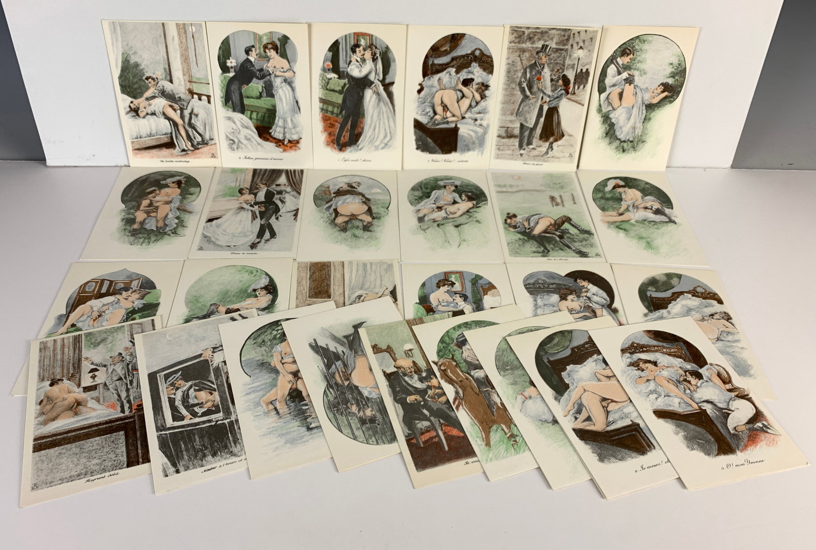 28 Erotic Vintage French Postcards: 28 vintage erotic postcards, all colorfully illustrated with erotic scenes, featuring French titles and postal information. Many include artist logos. Never used. Size: 5.5" x 3.5". Condition: Very go