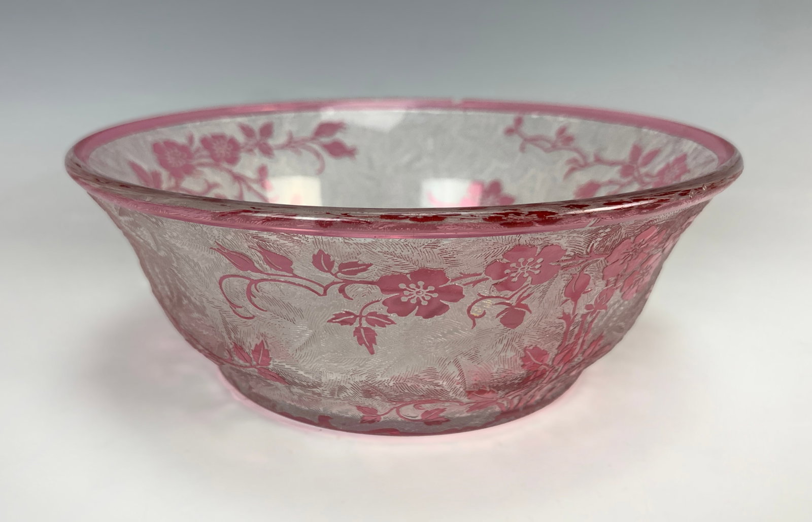 Baccarat Attributed Acid Cut Candy Dish: Unsigned. High rim bowl with a clear acid-cut body and cranberry cameo designs of flowers and leaves. Size: 2.5" tall x 6.25" wide. Condition: good, with a tiny imperfection on the red rim, hardly not