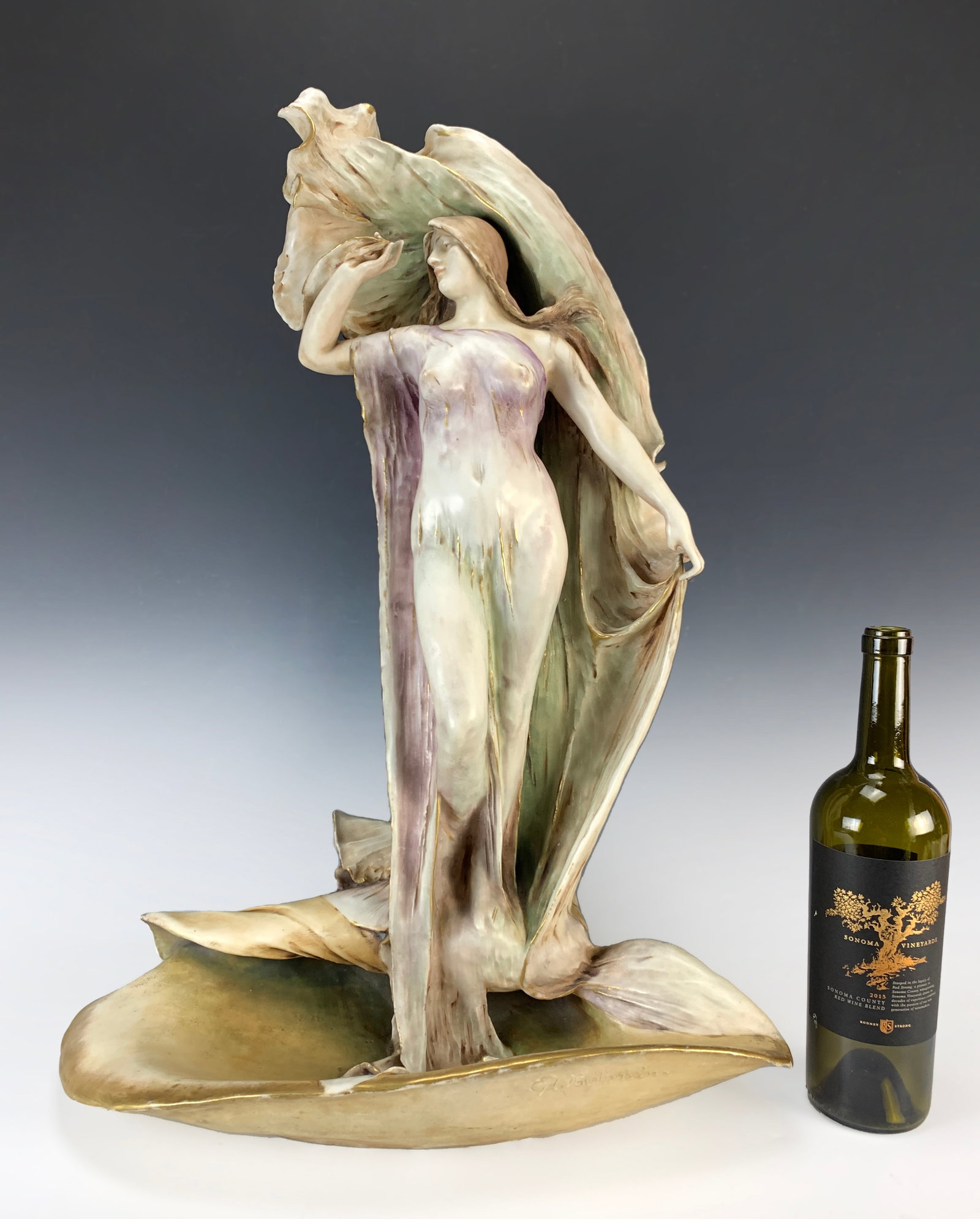 Huge Amphora Art Nouveau Figural Maiden: Circa 1900. Fabulous porcelain figure of a maiden on a conch shell. All porcelain signed Ed Stellmacher, also has RSTK red mark with number 1284 and amphora within an oval impression. An example of th