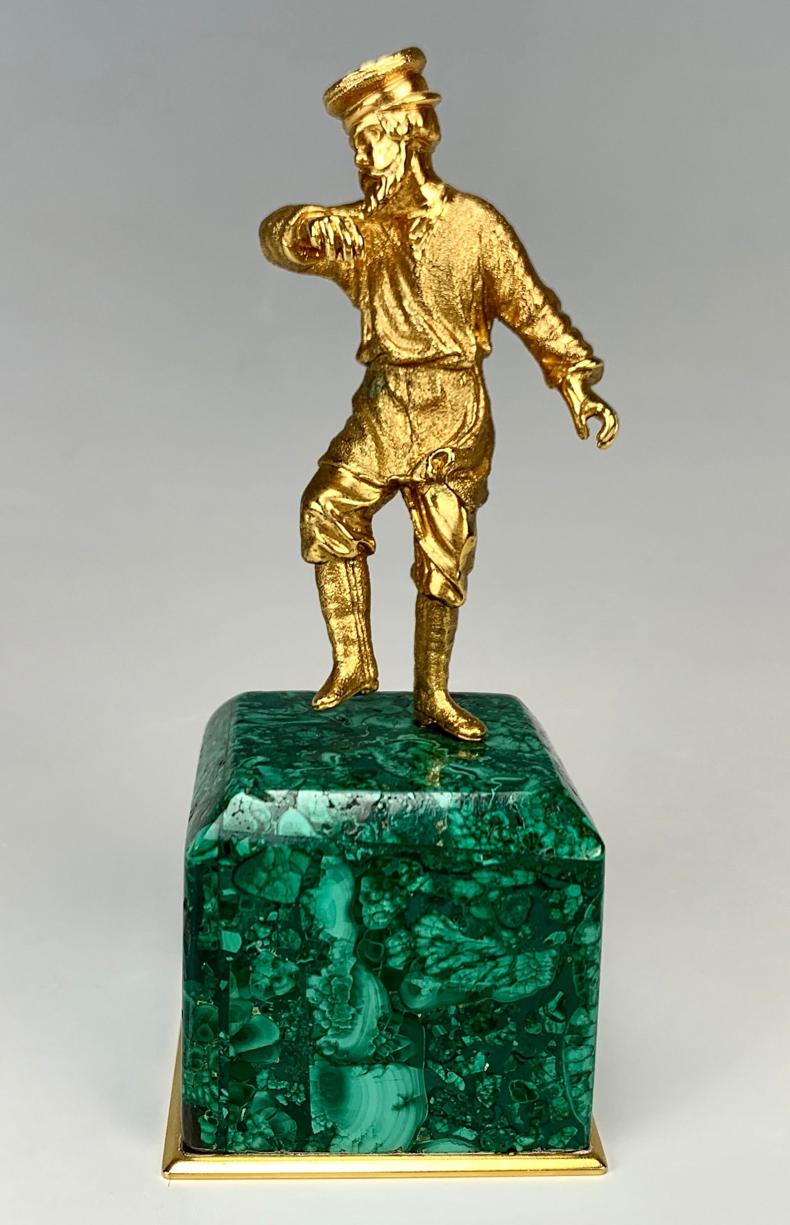 Russian Gilded Bronze Dancer w/Malachite Base: Nice quality gilt bronze of a dancing Russian man. Mounted above a square beveled malachite base lined with gilt bronze at the very bottom. Size: 4" tall (total height). Condition: Very good.
