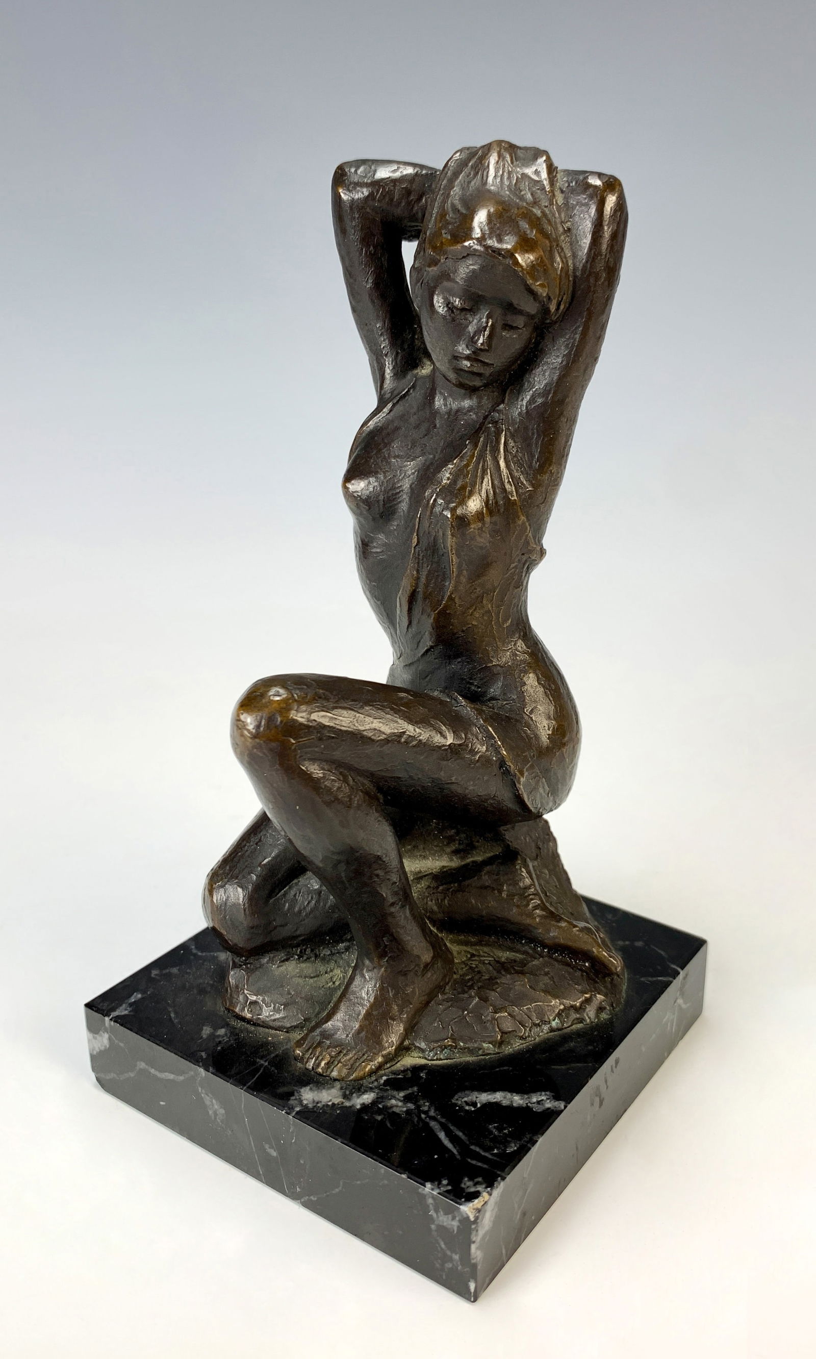 Bronze Semi-Nude Kneeling Lady Figurine: Signed with monogram, sculpture of a young woman mounted on a marble base.Very good condition. 7" tall with base. *In-house shipping within the U.S. available for this lot*