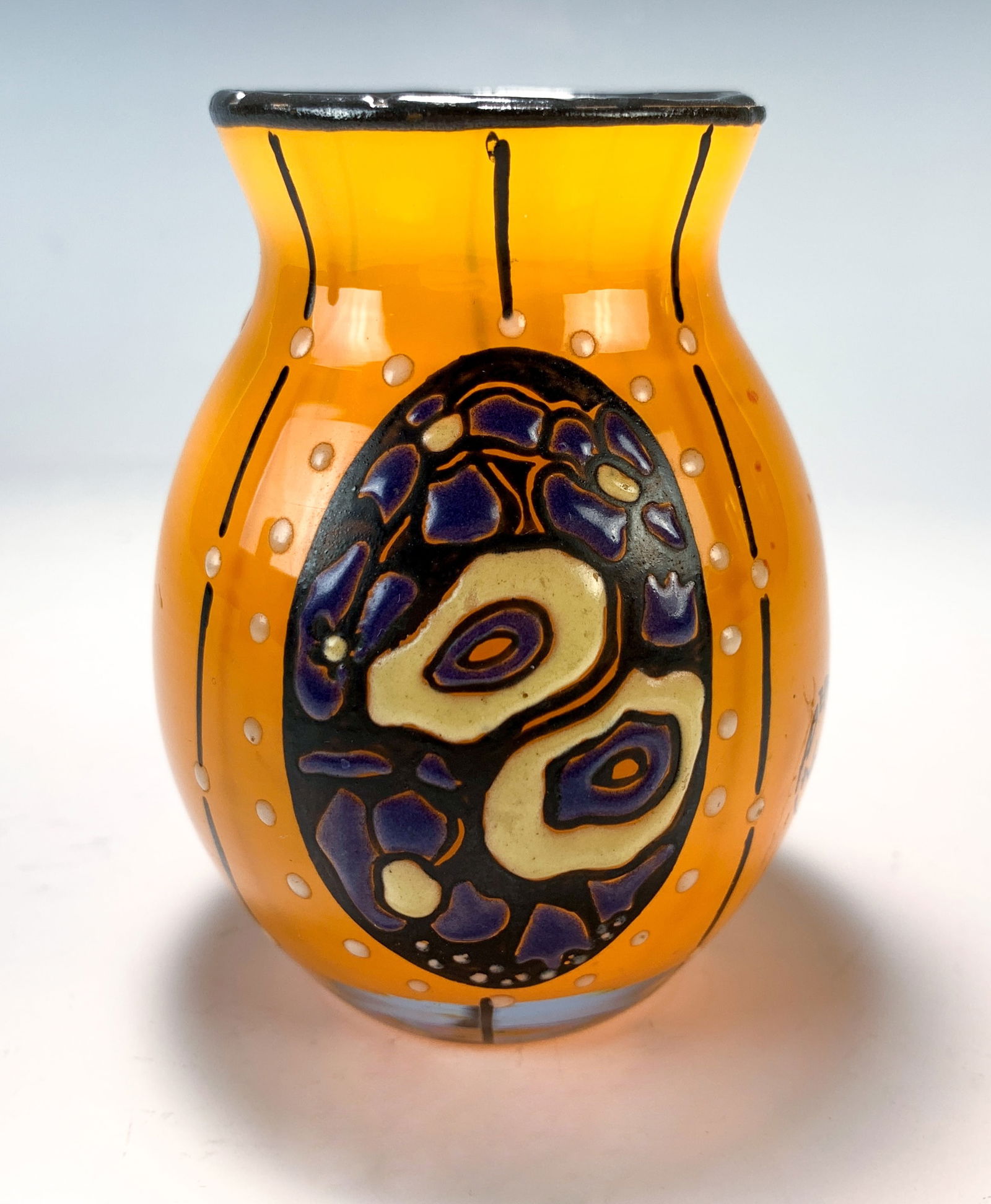 Delatte Nancy Art Deco Enameled Glass Vase: Circa 1920, French very art deco ovoid shouldered vase with applied enamel oval decoration against orange glass, signed "Delatte Nancy", very good condition, 3-5/8" tall x 2-3/4" wide, *In-house shipp