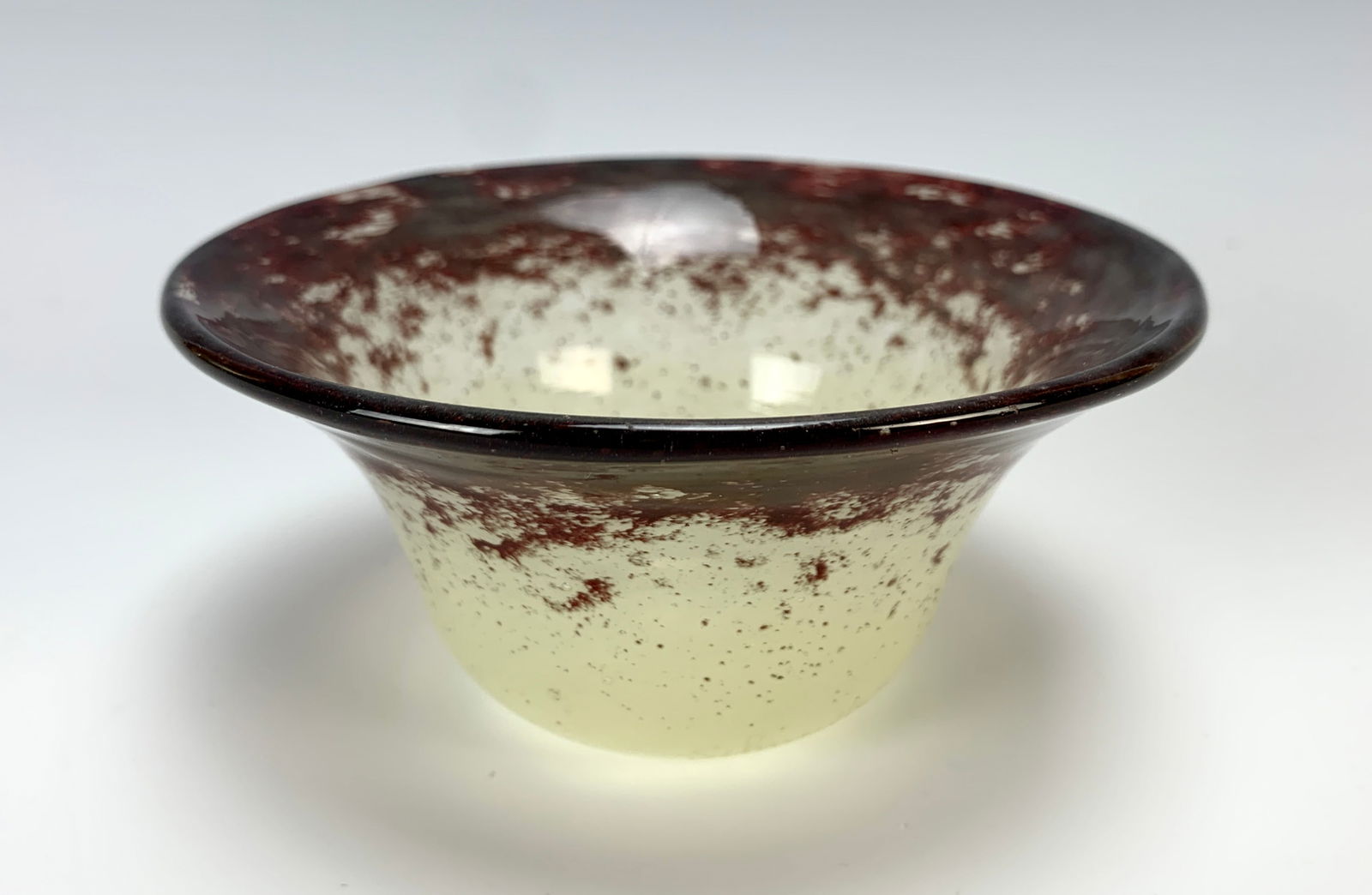 Schneider Art Deco Art Glass Bowl: Circa 1930, Schneider art glass vase of mottled glass with mahoghany purple red upper portion and white lower portion, featuring a flared neck. Signed "Schneider".very good condition, 2.5" diameter x