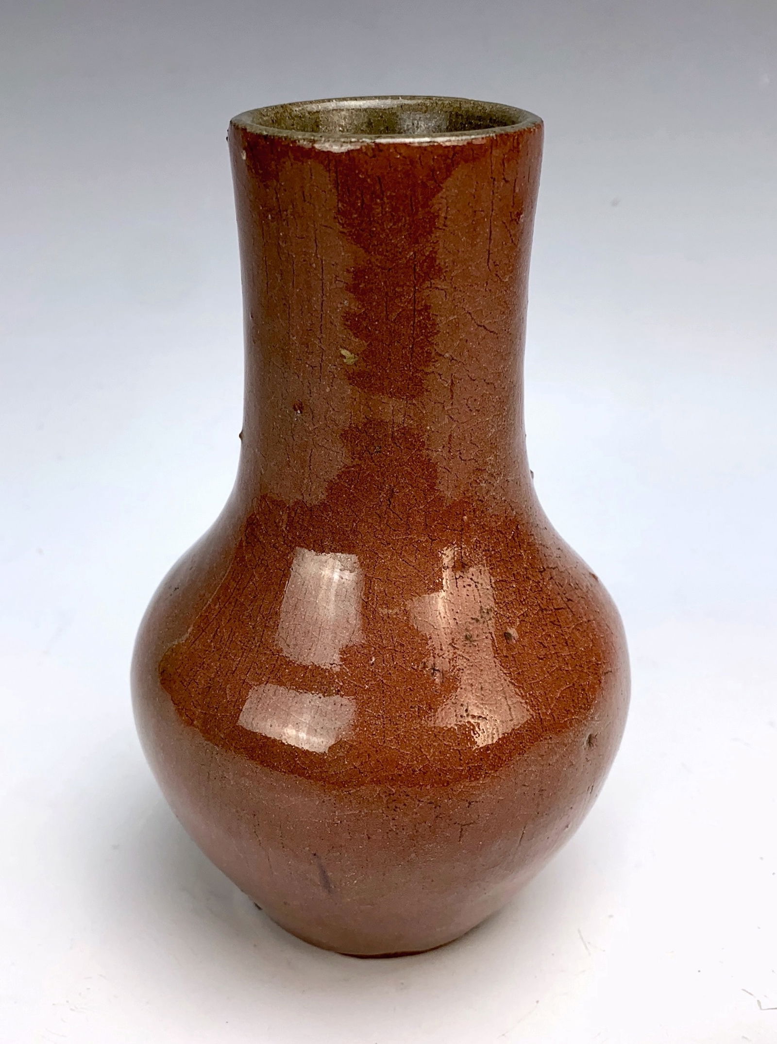 Auguste Delaherche Pottery Vase: Auguste Delaherche (French 1857-1940), a pottery baluster-shaped vase in purple enameled sandstone, marked. 1/4" factory imperfection on shoulder. 6" tall *In-house shipping within the U.S. available