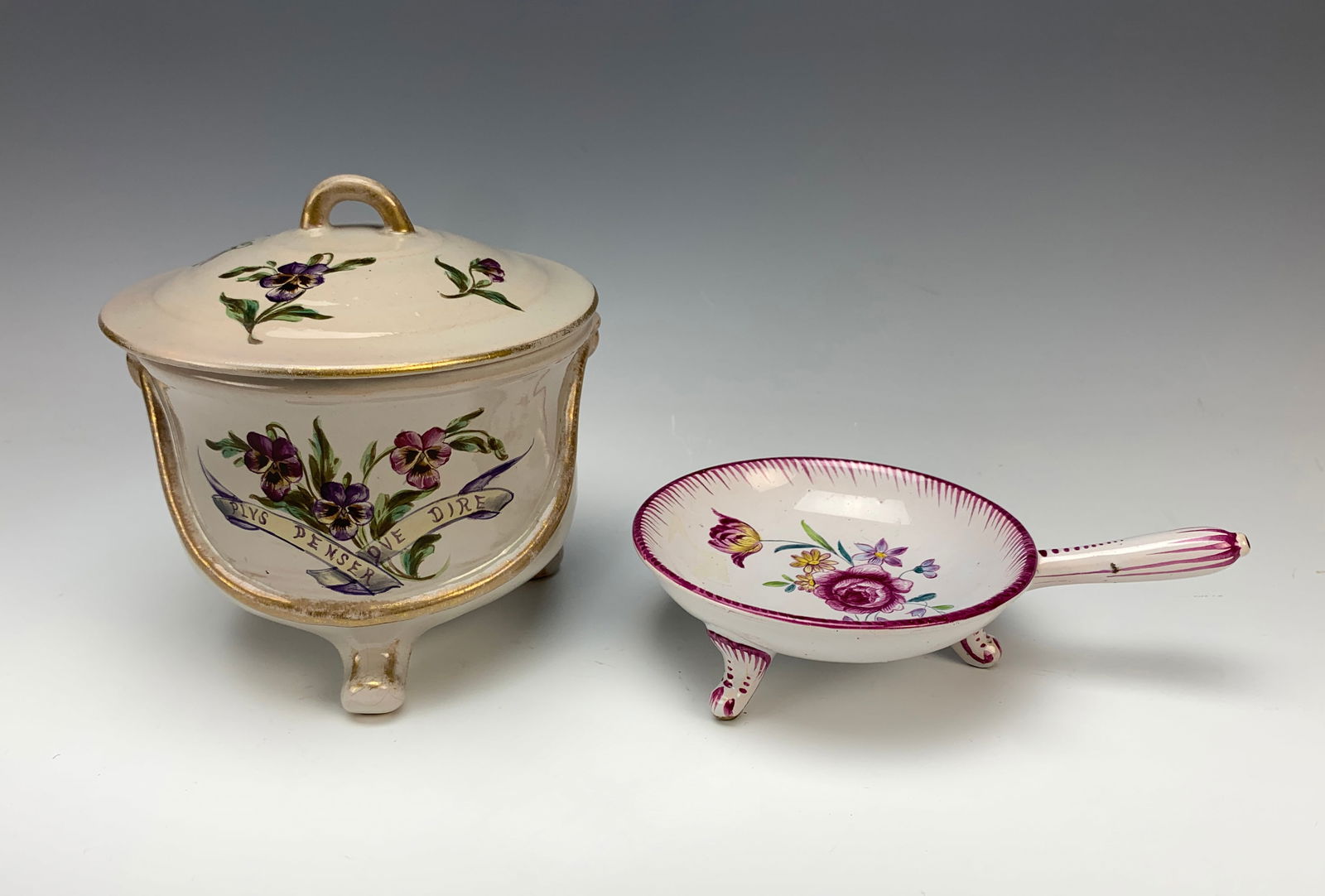 Pair Galle Pottery Handled Dish & Frypan Dish: Circa 1900. This lot includes a handled pot with cover and dish with handle shaped like a fry pan, both painted with flowers and signed Galle Nancy. Size: 5" tallest. Very good condition. *In-house sh