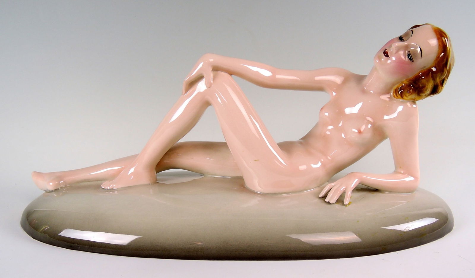 Goldscheider Nude Figurine signed Lorenzl: Circa 1930, Germany, artist (Lorenzl) and manufacturer signed and numbered ceramic figure of an art deco nude with great glossy glaze, signed "Lorenzl" and "Goldscheider", "Made in Germany", and numbe