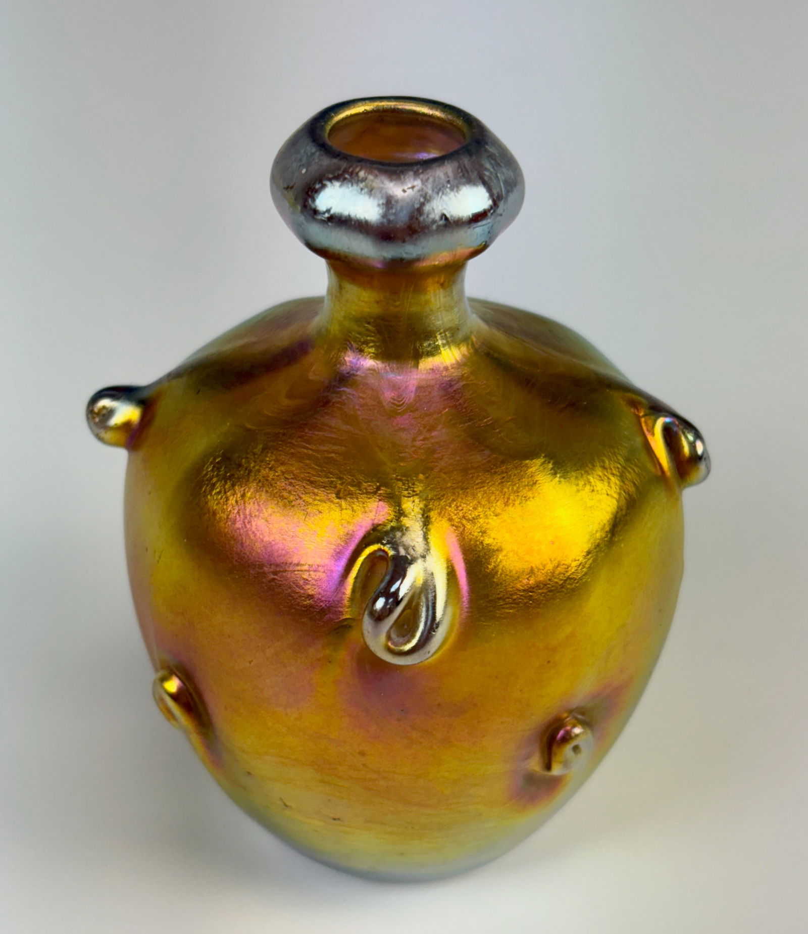 Tiffany Studios Miniature Cabinet Vase w Prunts: A fine Tiffany Studios gold Favrile cabinet vase decorated with 9 prunts throughout, signed and numbered "L.C. Tiffany Favrile 1005, 1214J. Very good condition, 3.25" x 2.5"*In-house shipping within t