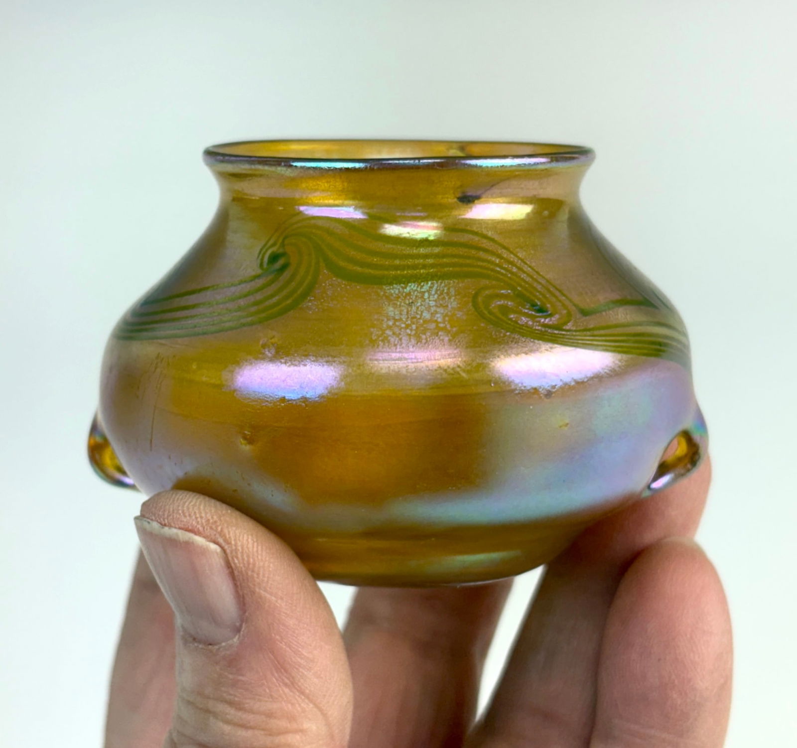 Tiffany Studios Miniature Favrile Cabinet Vase: Tiffany Studios double handled miniature iridescent gold and green feathered art glass cabinet vase, signed "L.C.T. 953B", very good overall condition, tiny burst air bubble on inner top lip, 2" x 2.5