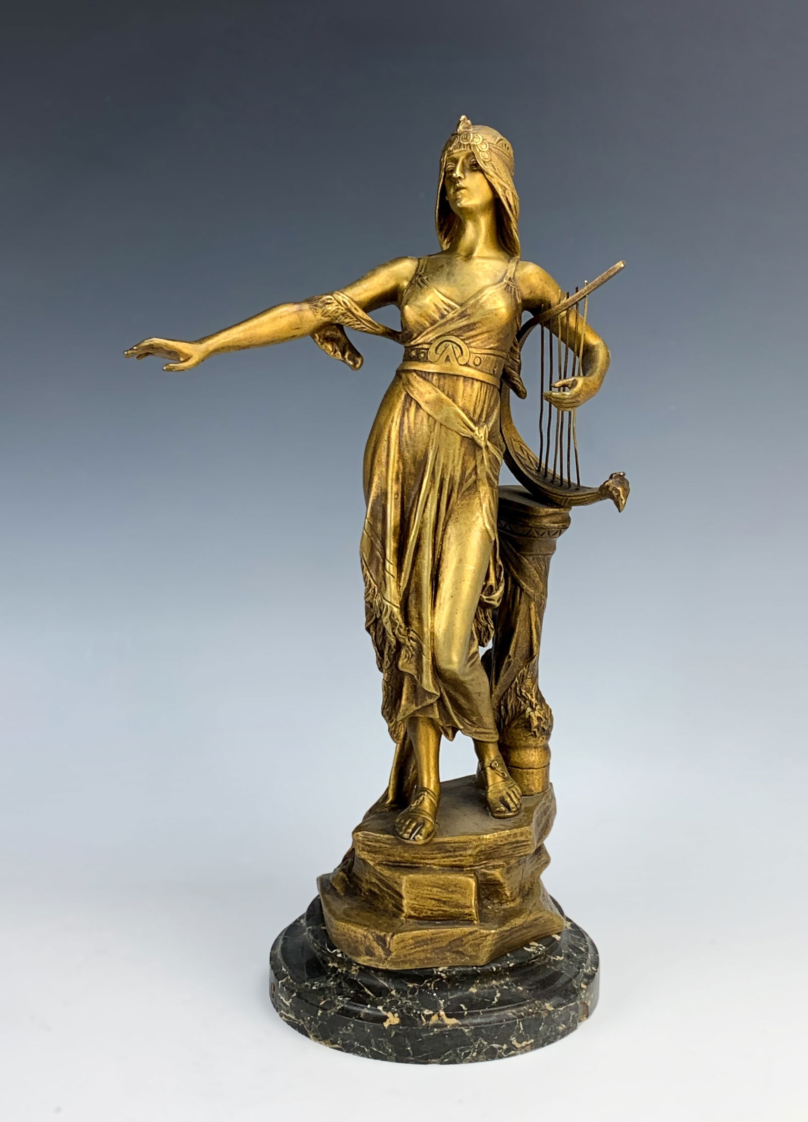 Edouard Drouot Bronze Sculpture Salome at Harp: Circa 1890, Edouard Drouot (French 1859-1945) Dore bronze figure "Salome at the Harp" dated to the beginning of the 20th century and is signed "E Drouot" and mounted atop a beveled black veined marble